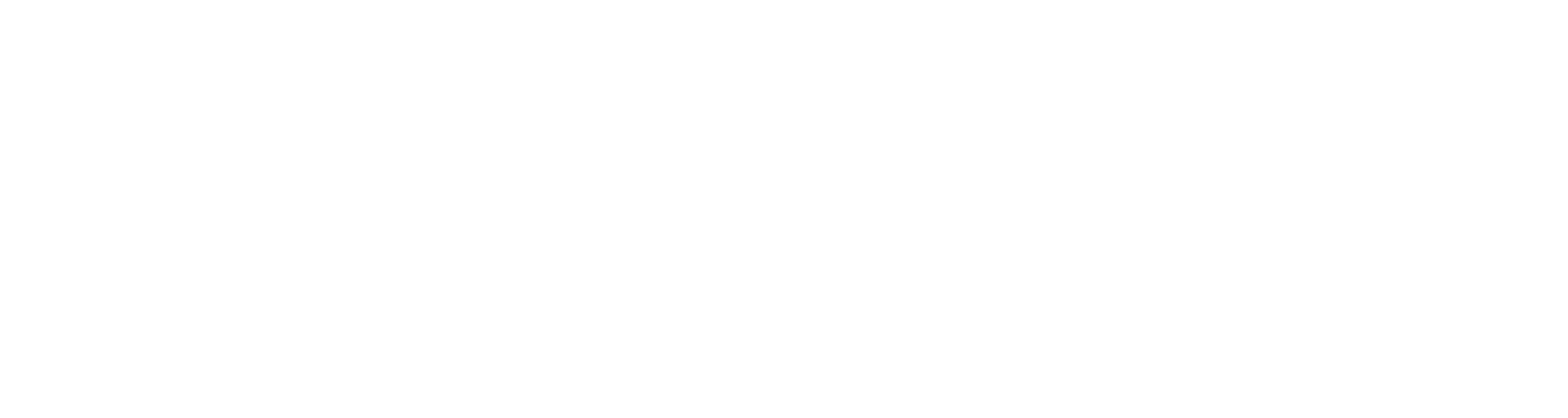 Silhouette of a person paddling a canoe in water.