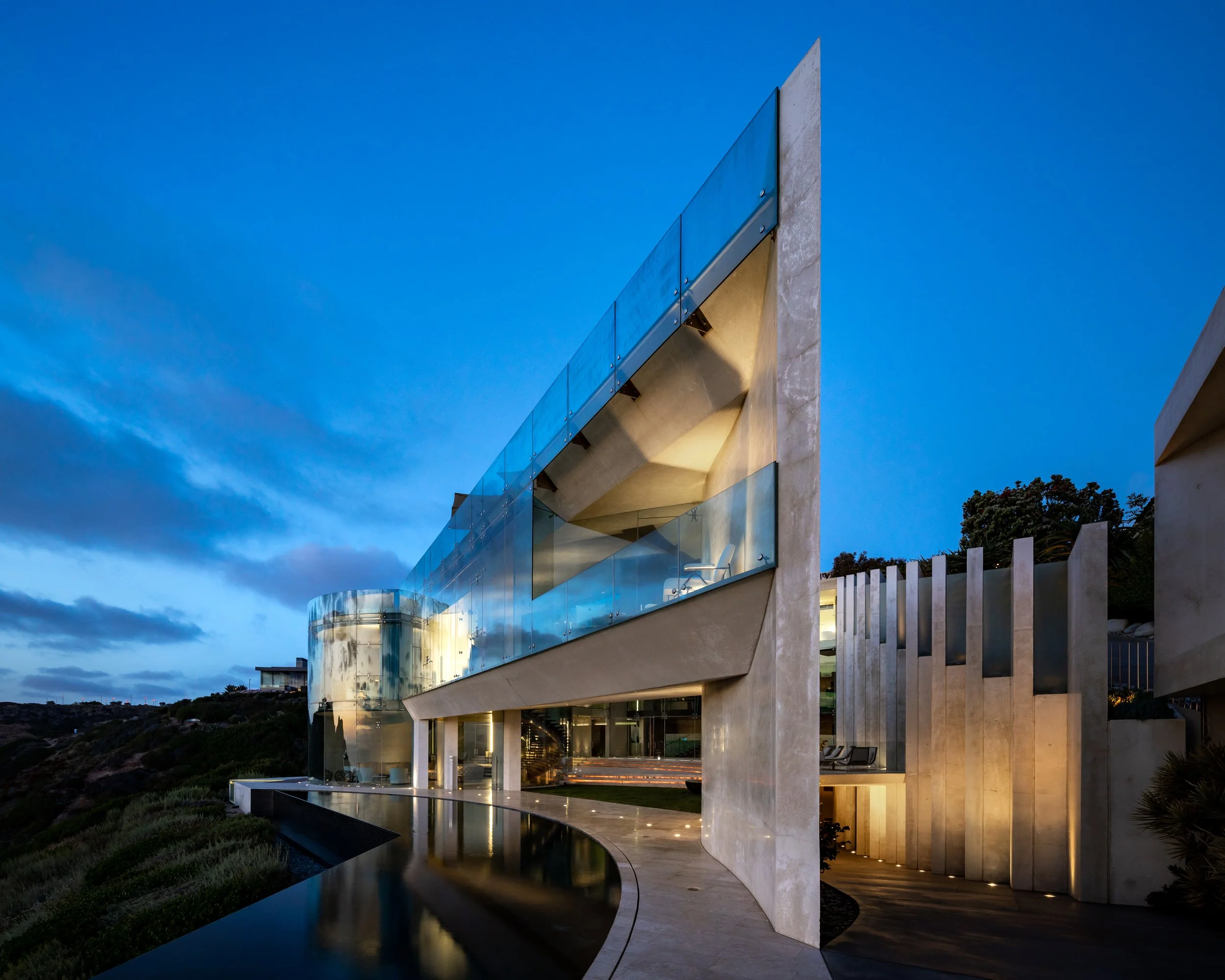 The Razor House in La Jolla photographed at twilight with modern concrete and glass architecture.