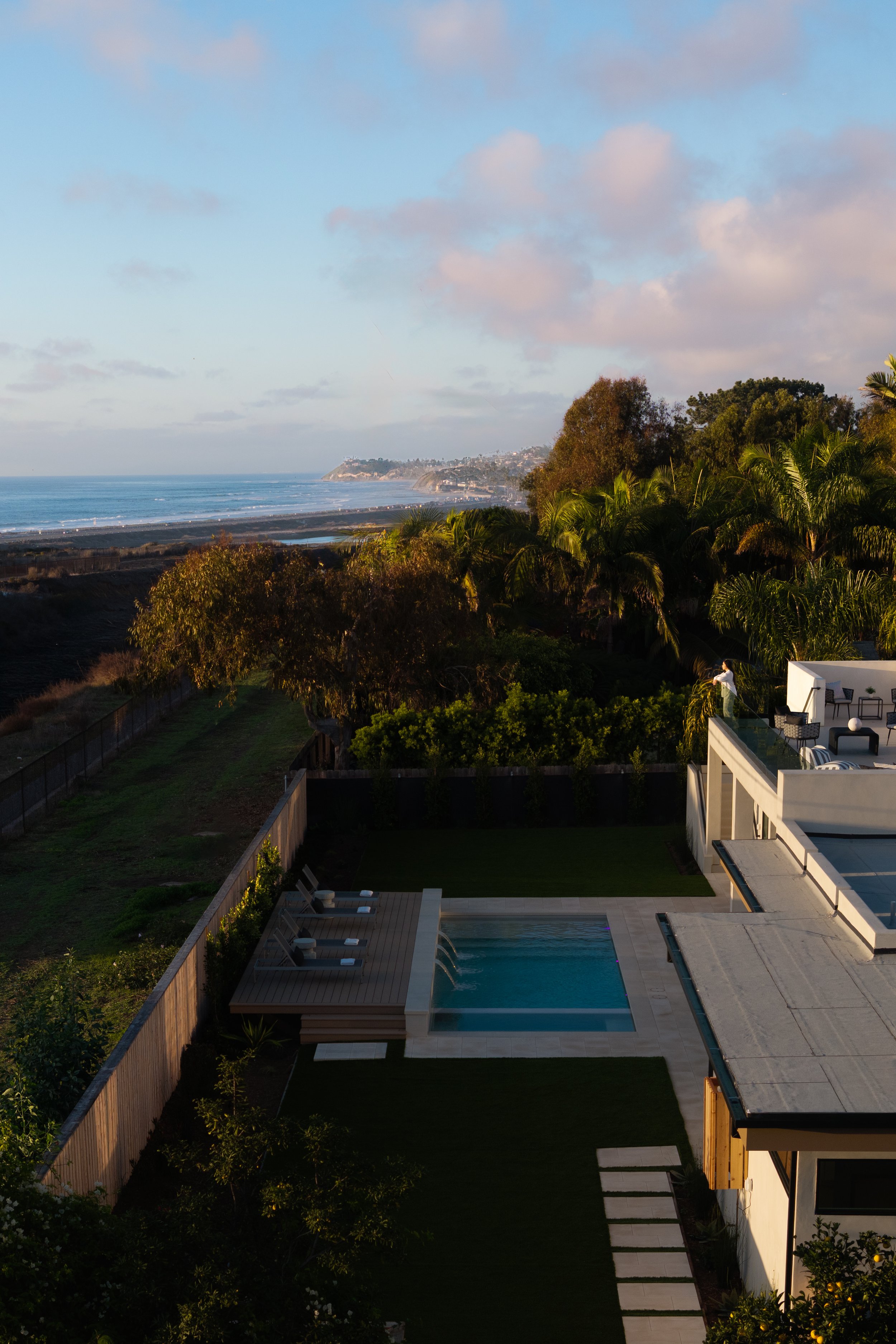 Contemporary coastal residence with pool, ocean views, and modern outdoor living spaces.