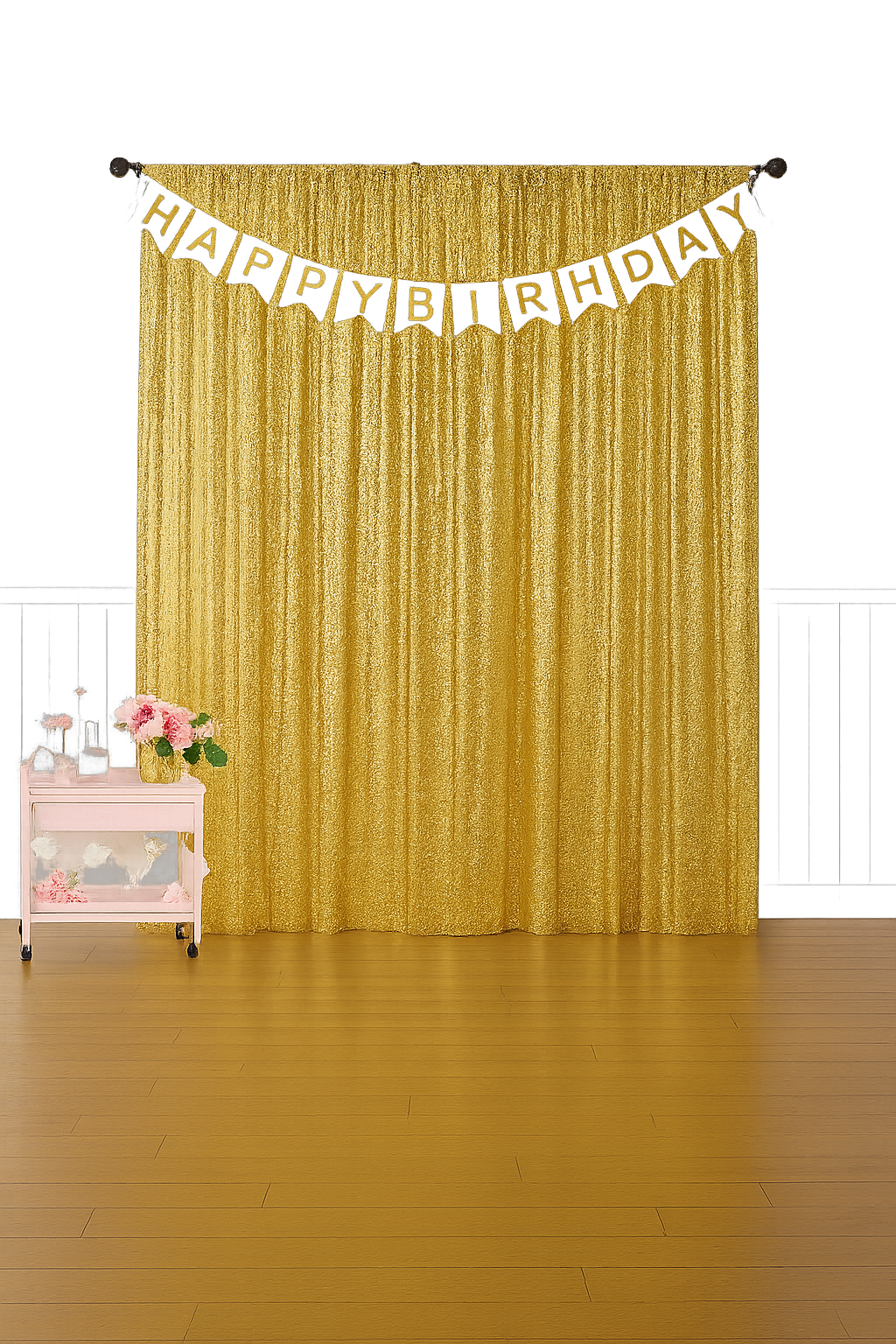 Gold glitter curtain with 'Happy Birthday' banner and a small pink cart with pink flowers on top.