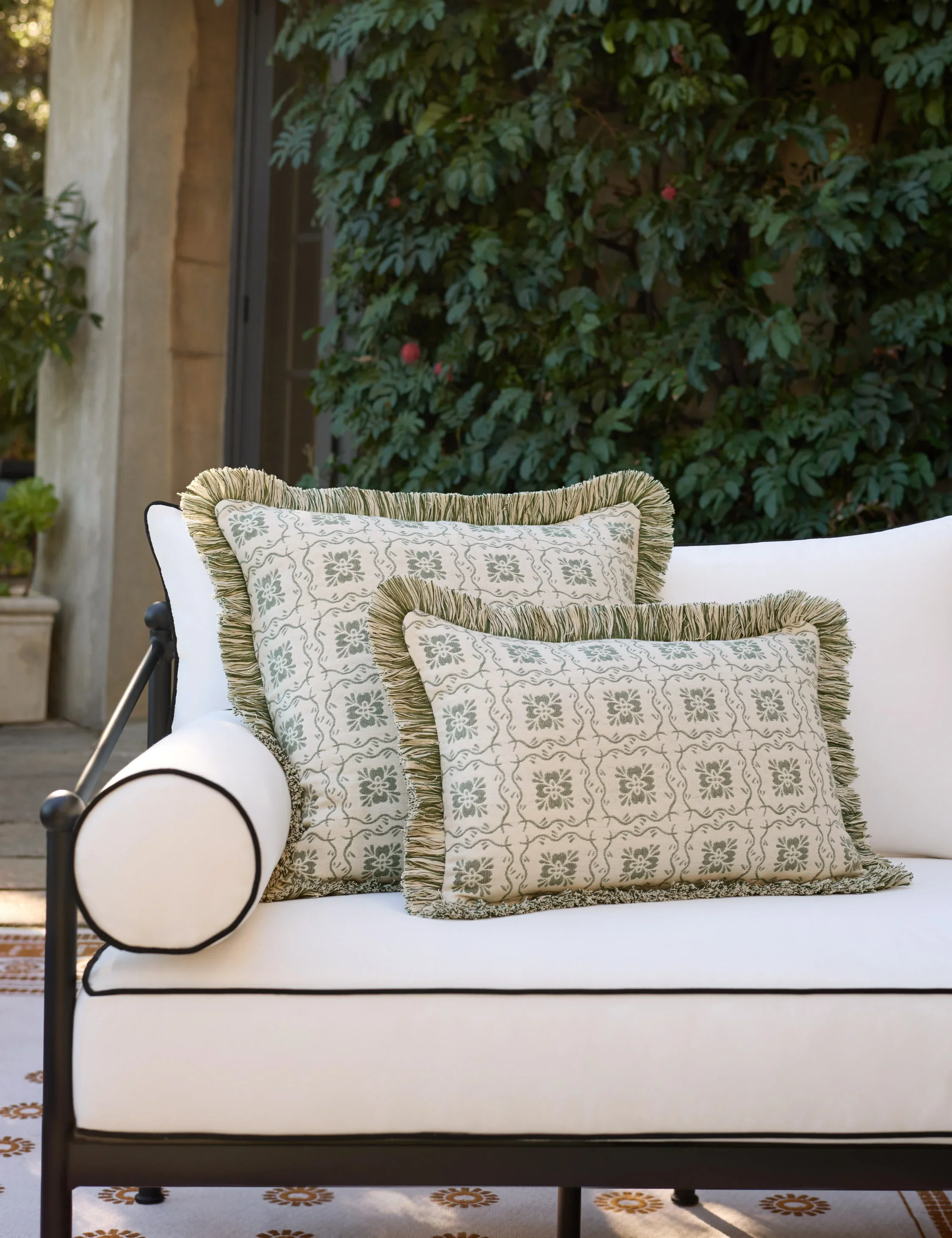 Lulu-and-Georgia_HalsteadIndoorOutdoorPillowCover_Emerald___Lifestyle.webp