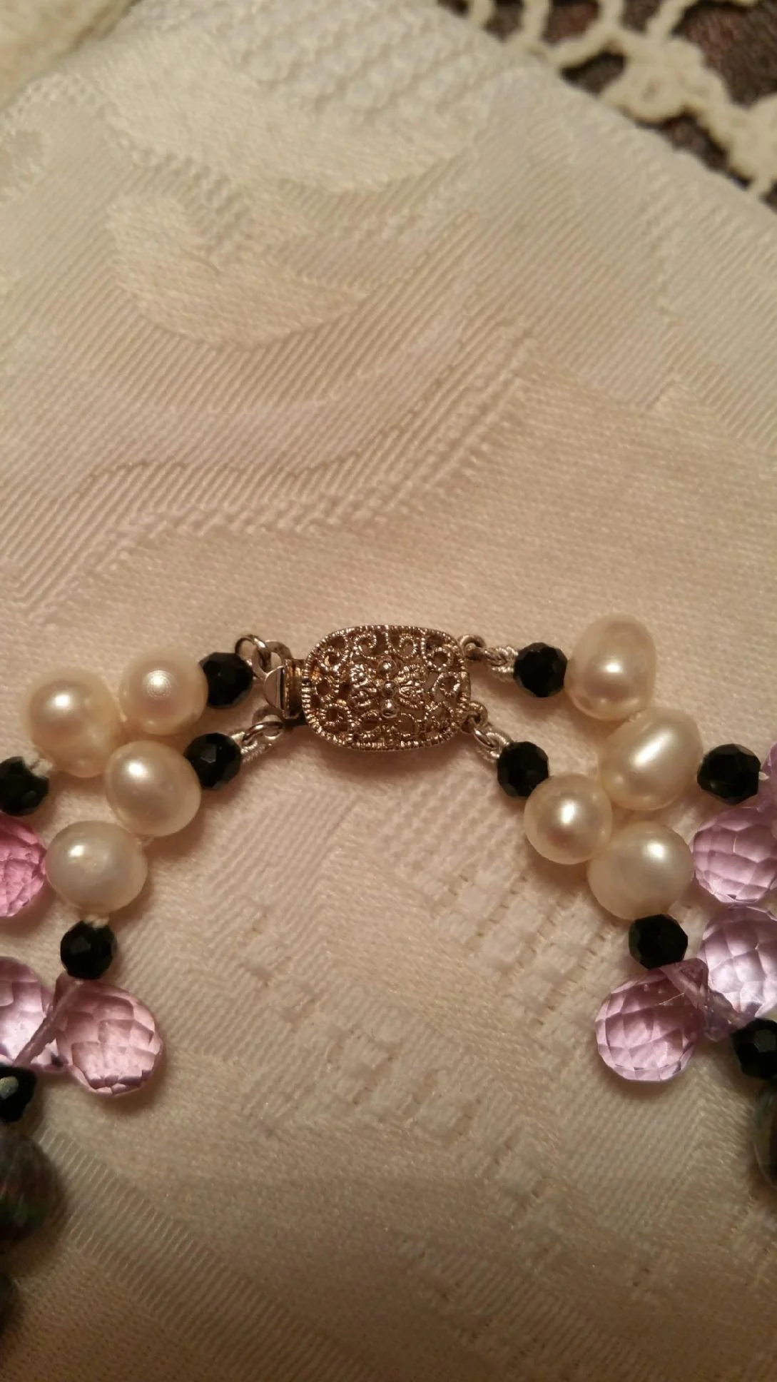 Clasp Detail Decorative replacement clasp selected to complement the original design.