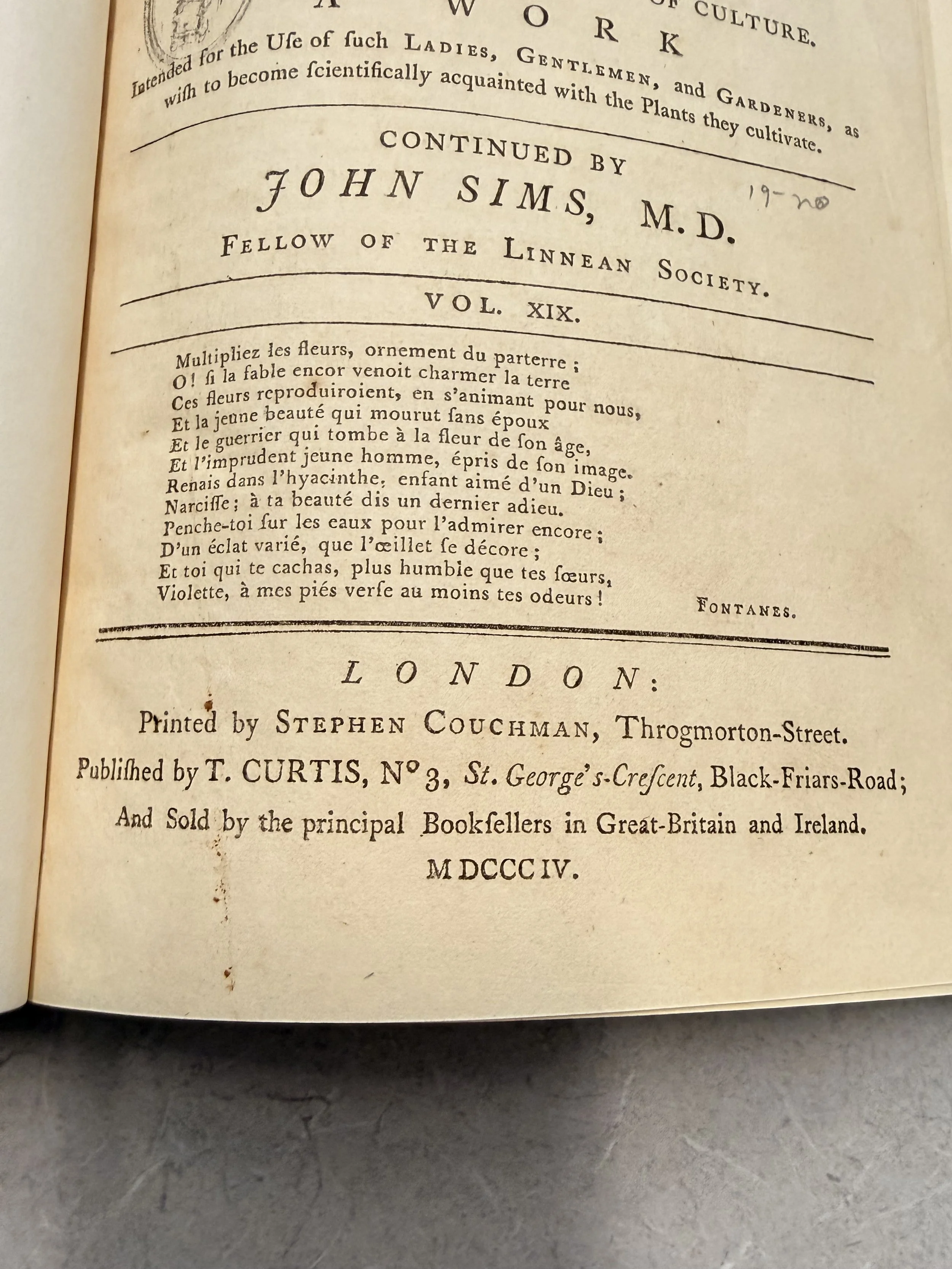 Page from an old book with printed text in French and English, including a poem and publication details from 1754.