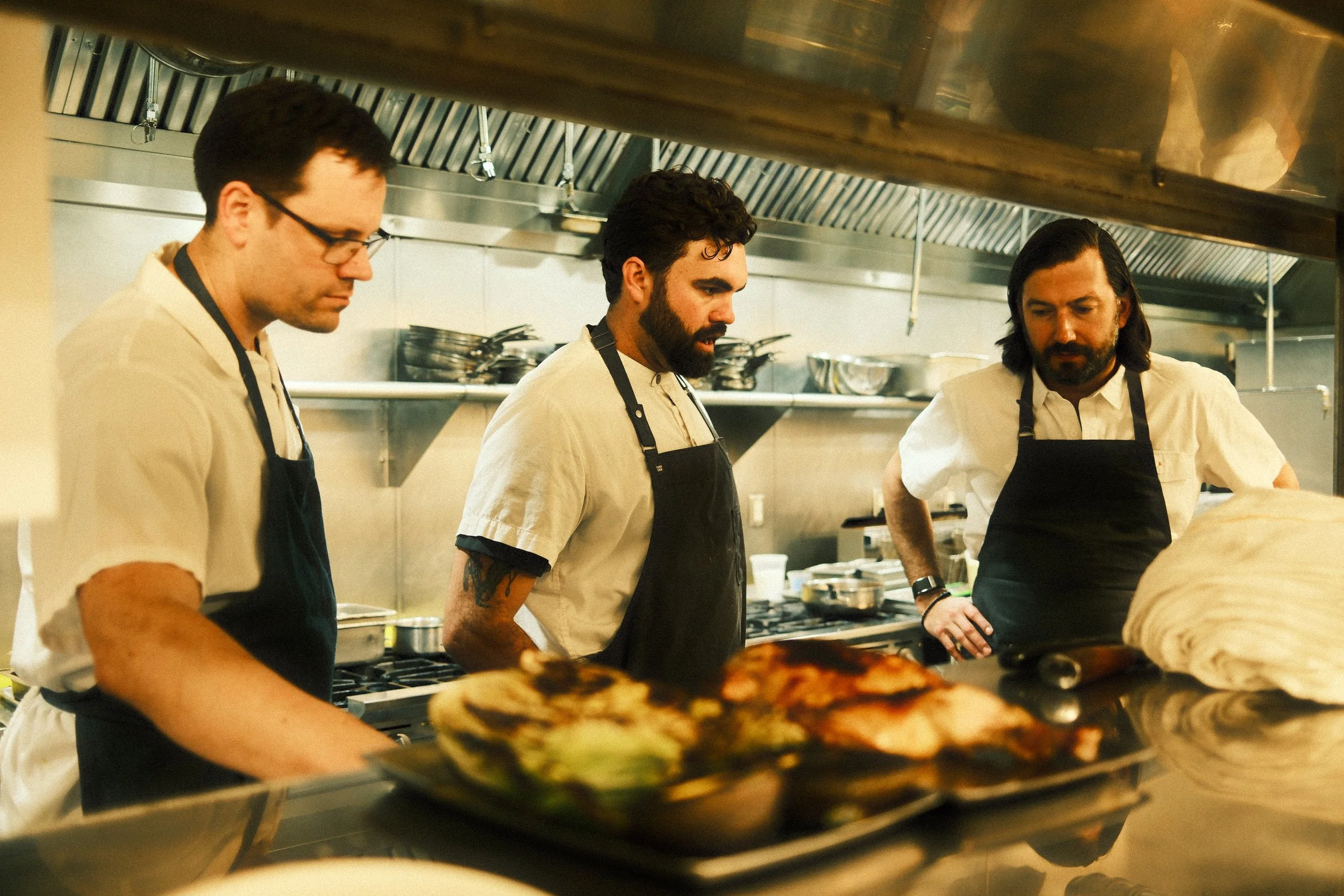 Chef Dylan McShan and team preparing dinner service.