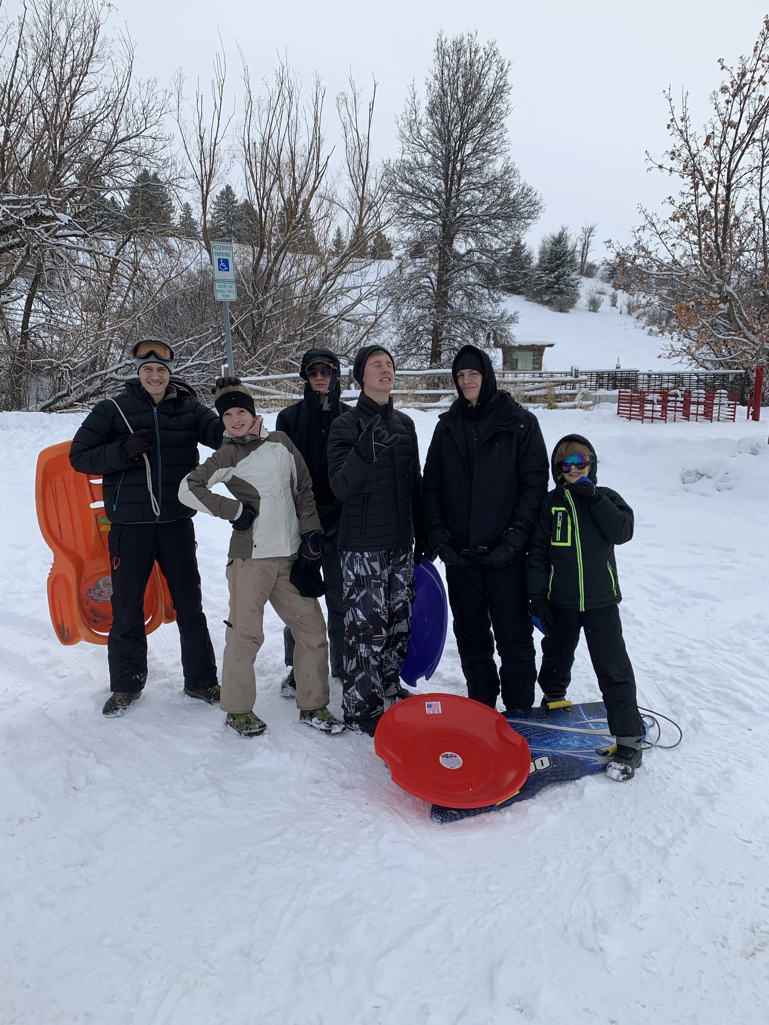 Teens sledding