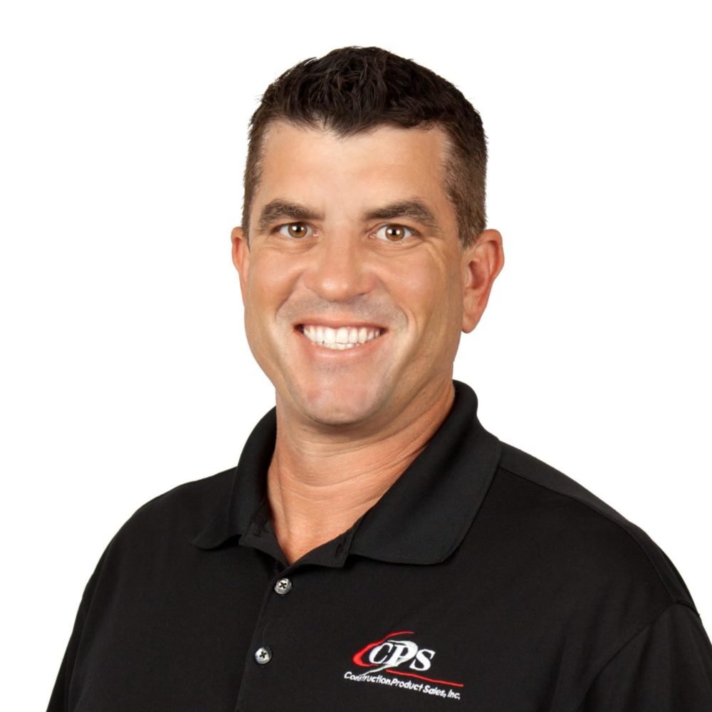 A smiling man with short dark hair wearing a black polo shirt with a CPS logo.