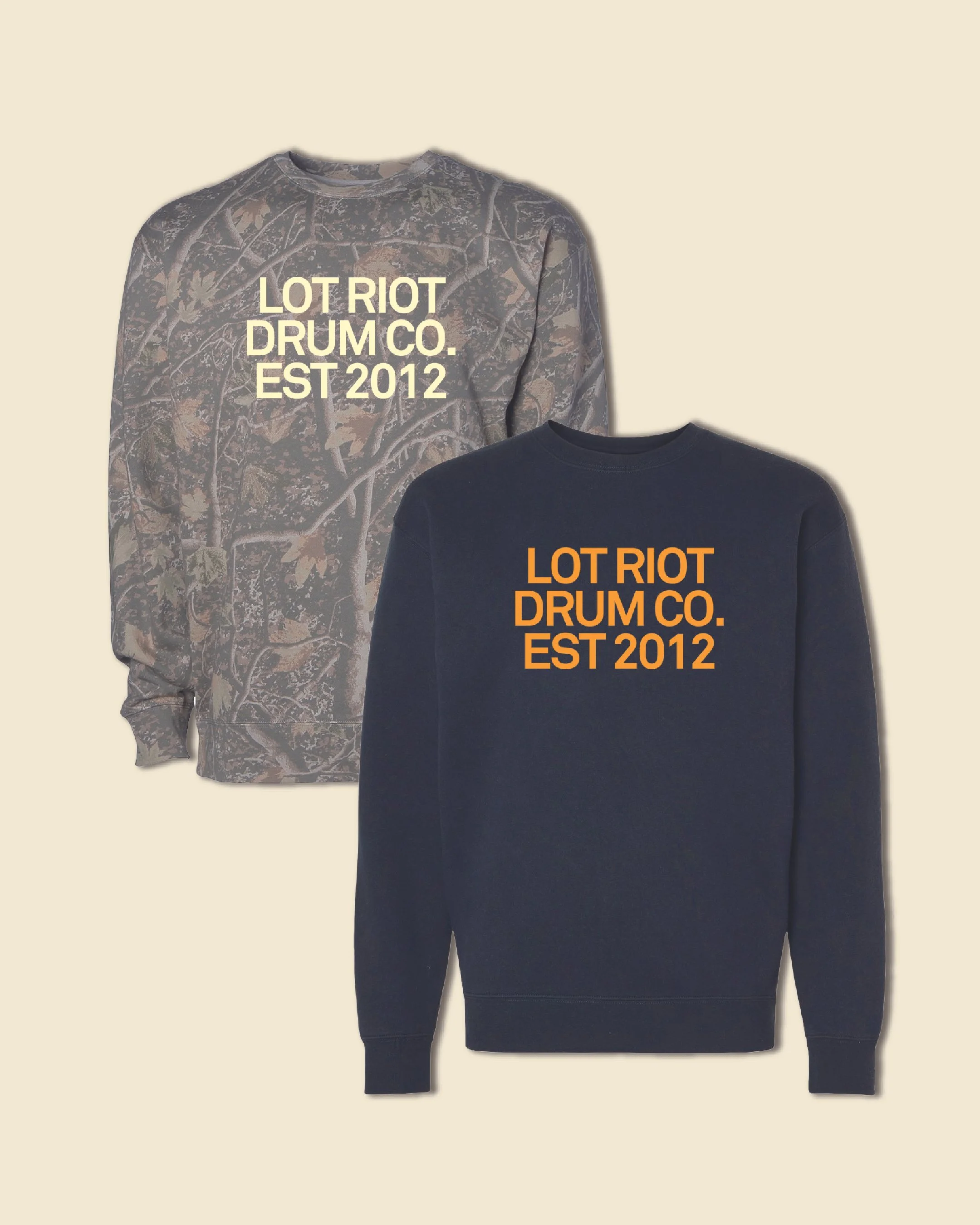 Two sweatshirts, one with a camouflage pattern and the other black, both featuring the text "LOT RIOT DRUM CO. EST 2012" in bold letters.
