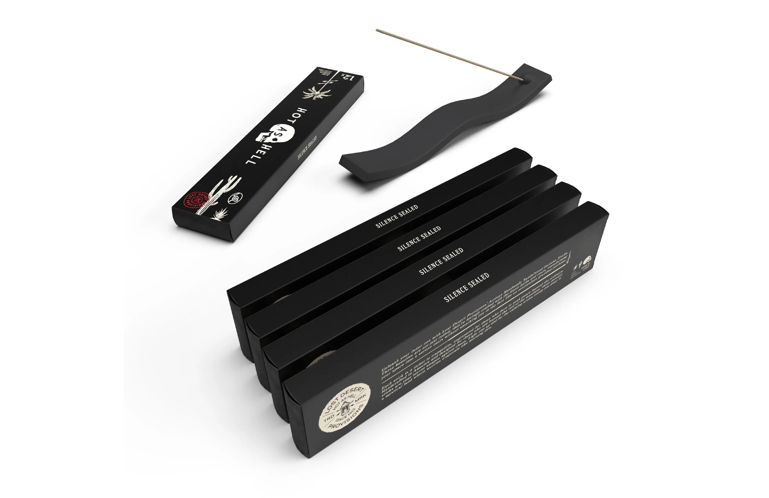 A pack of black matches labeled 'Silence Sealed' and a matchstick holder with a matchstick.