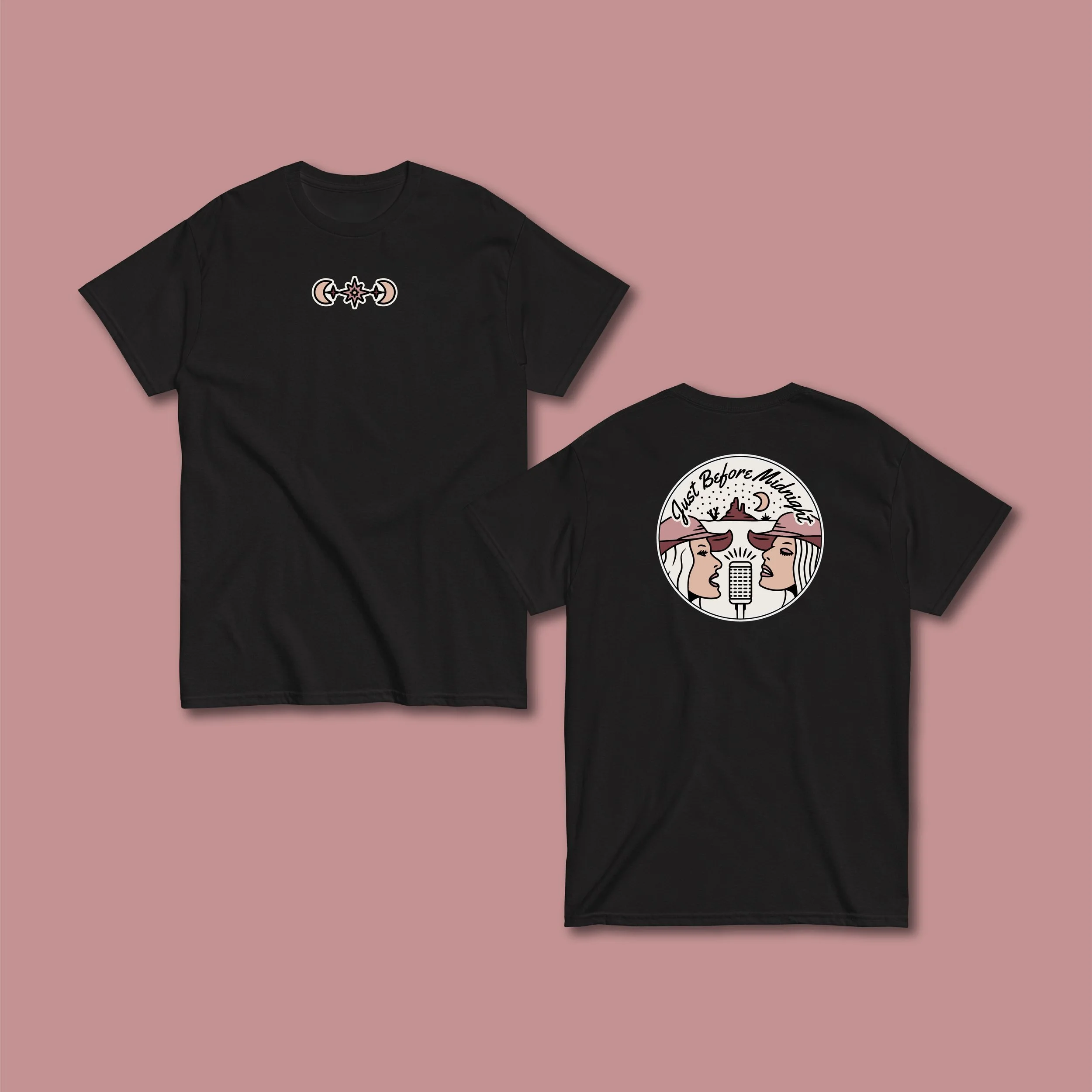 Black T-shirts with graphic designs laid against a pink background, featuring celestial and artistic symbols.