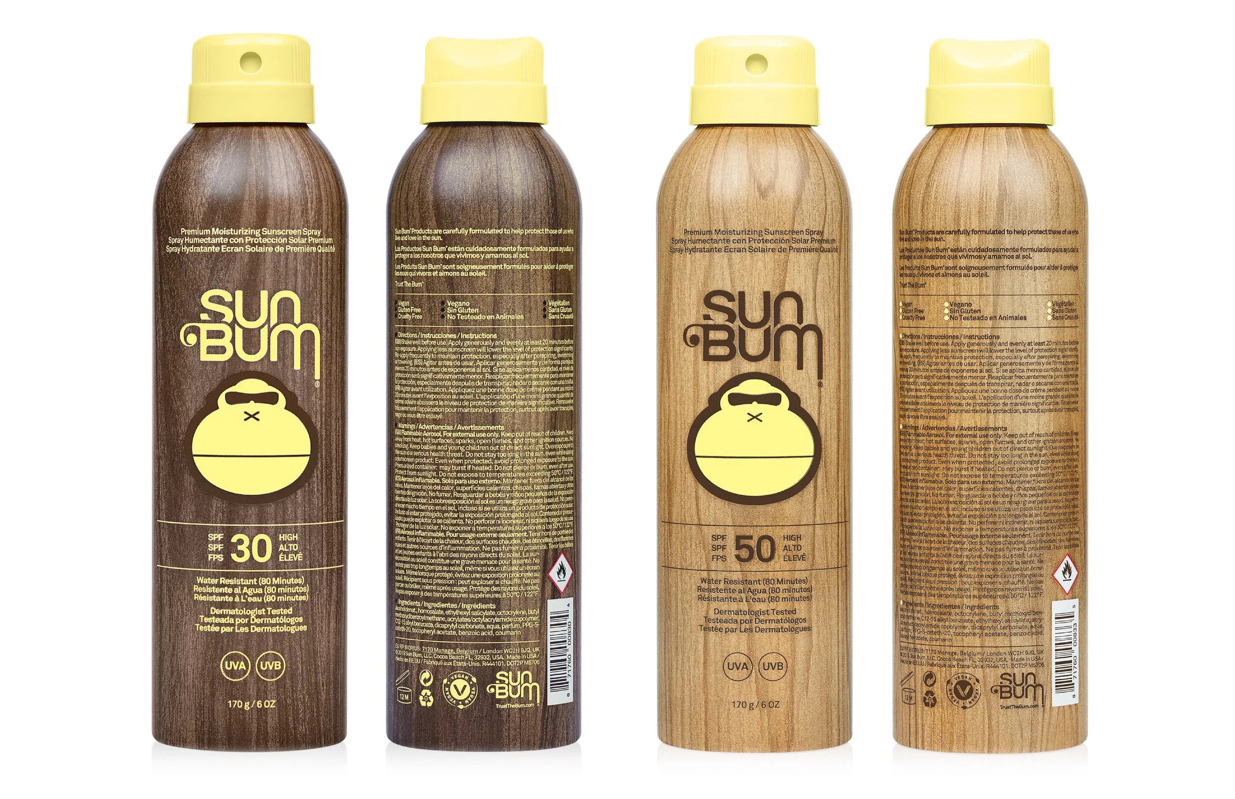 Four bottles of Sun Bum sunscreen with wooden-like labels and yellow caps, featuring different SPF levels of 30 and 50, standing side by side against a white background.