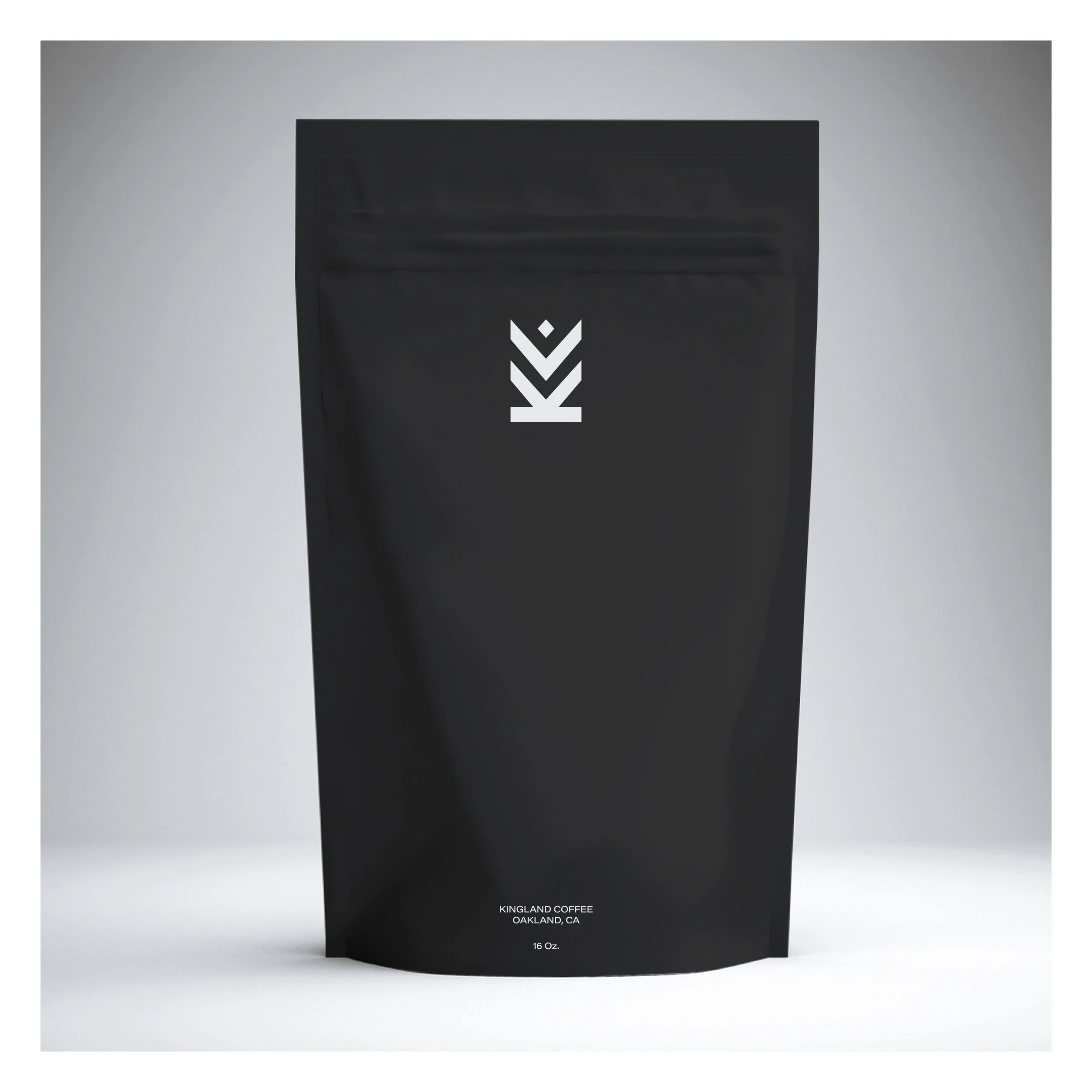 Black coffee bag from Kingland Coffee with white text, placed on a plain white background. The bag features a minimalist logo and indicates it contains 16 ounces of coffee from Oakland, CA.