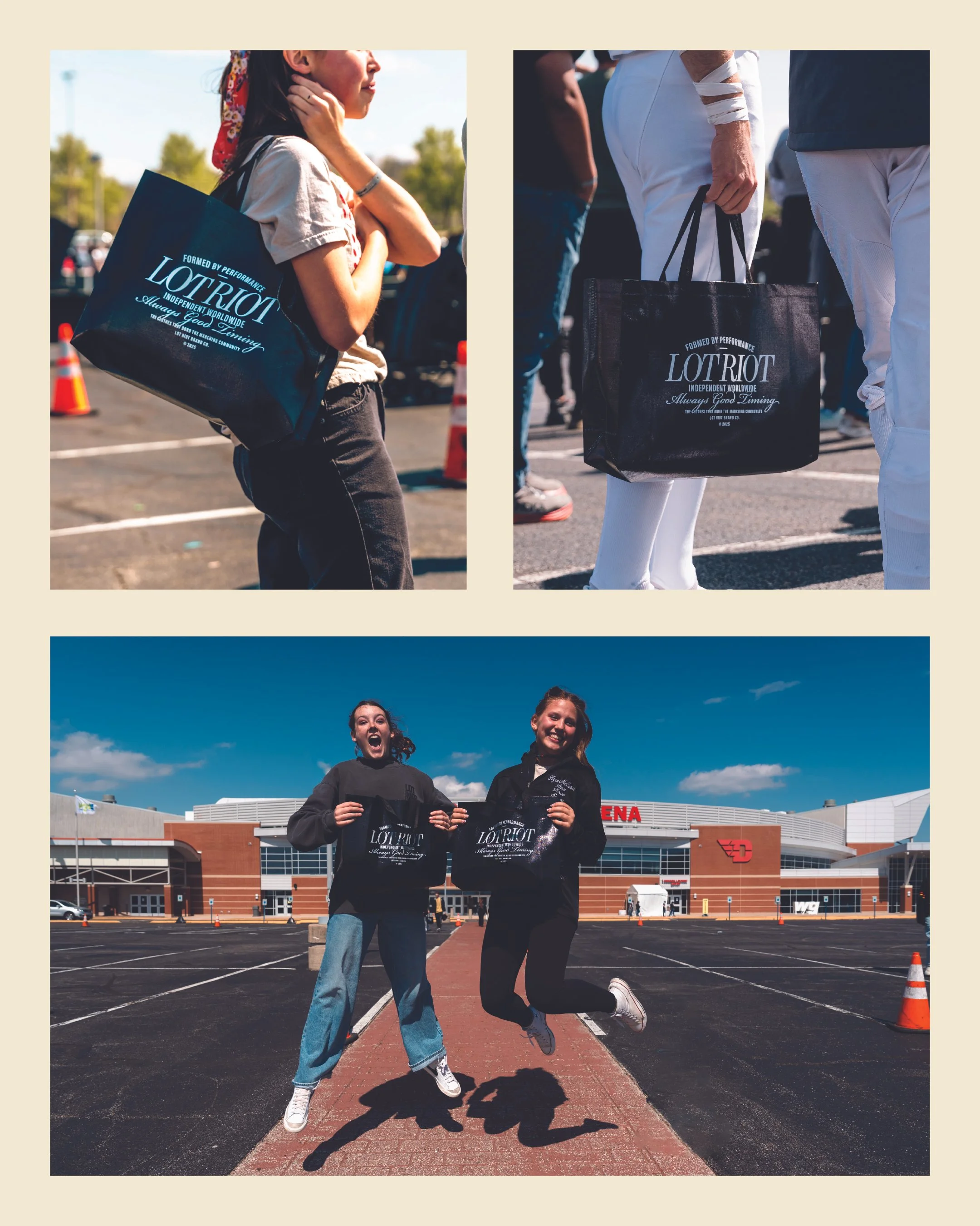 Two young women are in a parking lot in front of UD arena, holding black tote bags with the words "LOTRIOT" and cheering, with a bright blue sky and white clouds above.