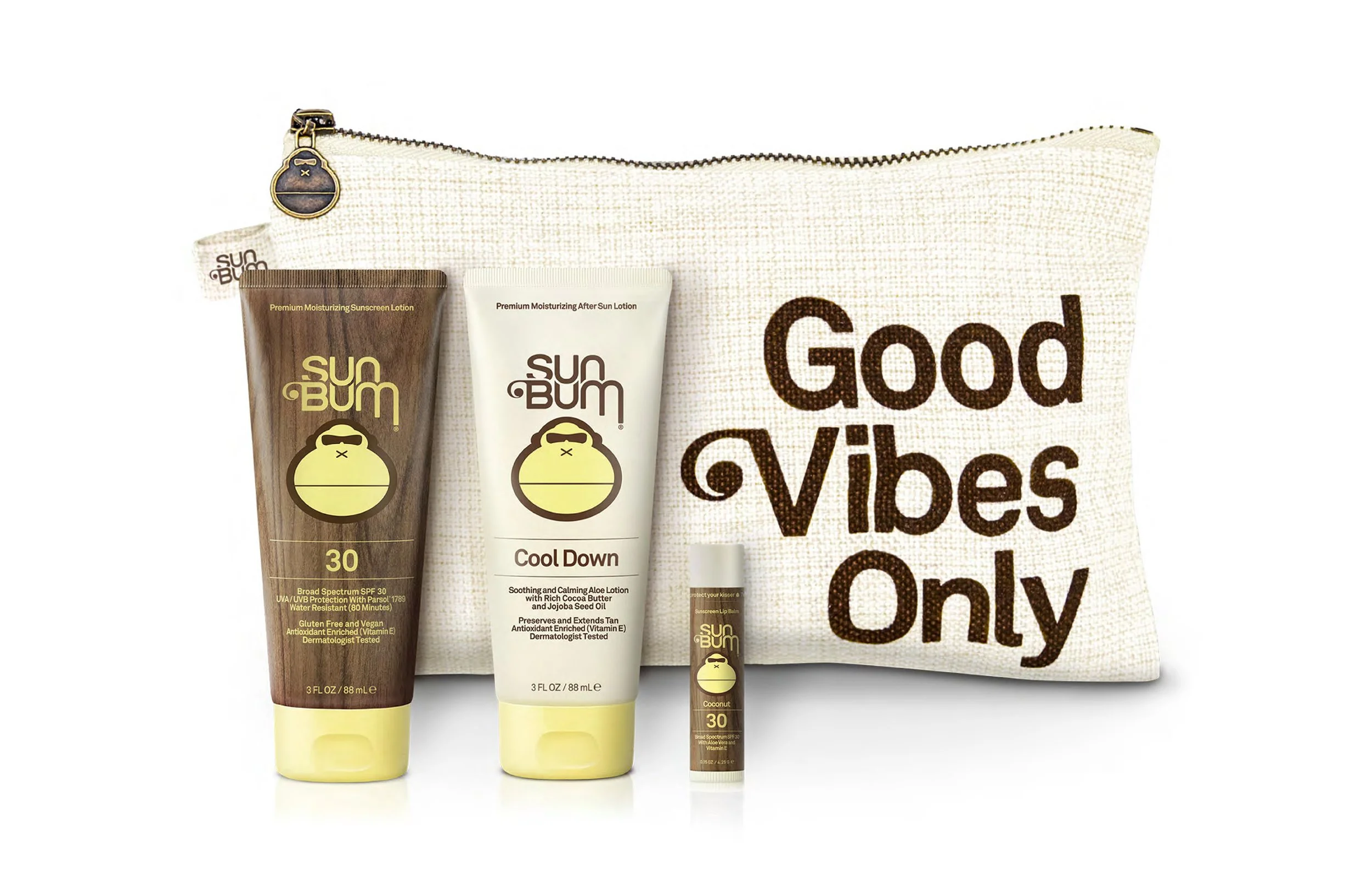 A collection of Sun Bum skincare products including sunscreen lotion, after sun lotion, and lip balm, placed in front of a Sun Bum bag with the text "Good Vibes Only".