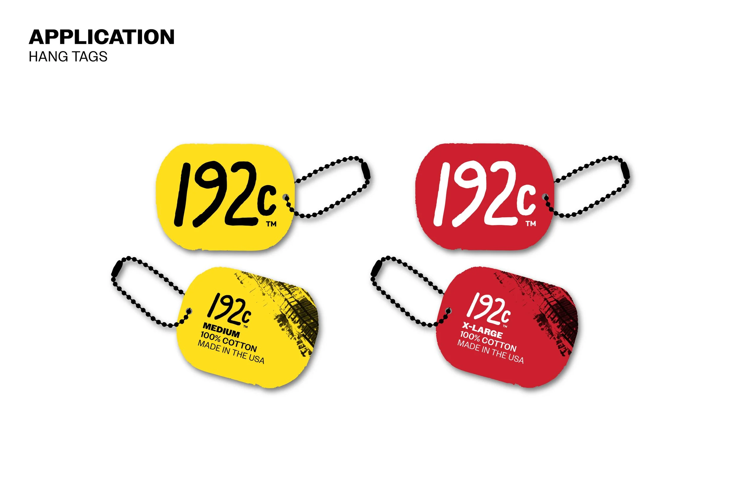 Close-up of colorful fabric hang tags with safety chain, labeled as 192 cents, in various sizes and colors, including yellow and red, made of cotton, with some text indicating 'Made in the USA'.