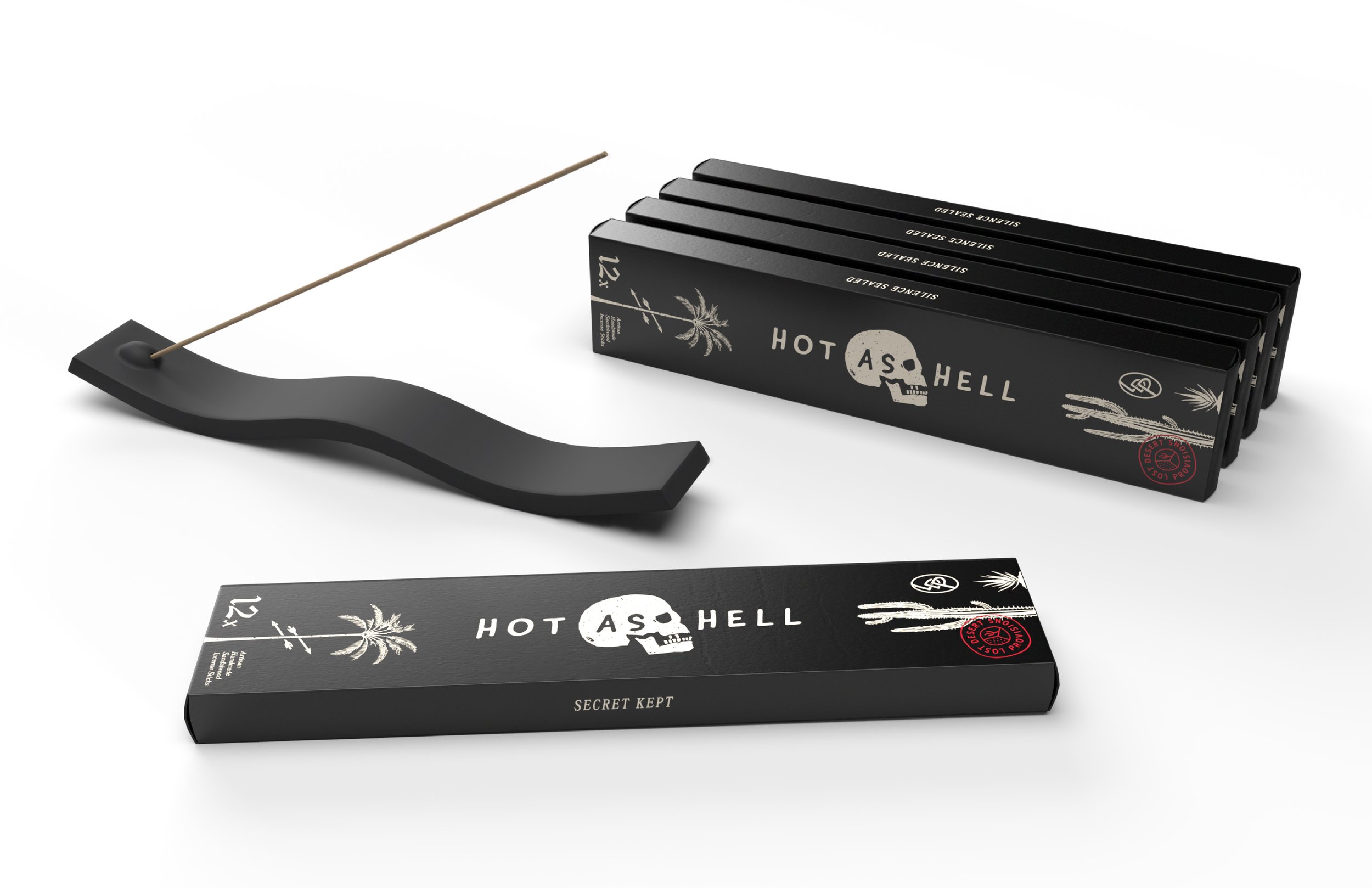 Set of black packages labeled "HOT AS HELL" with white and red text, a black holder, and a long matchstick.