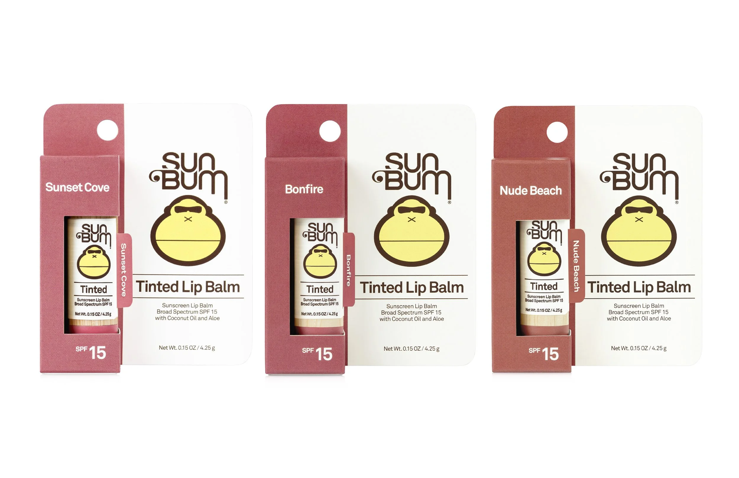 Three boxes of Sun Bum tinted lip balm with SPF 15, in Sunset Cove, Bonfire, and Nude Beach flavors. Each box contains a tube of lip balm with coconut oil and aloe, with net weight 0.15 ounces (4.25 grams).
