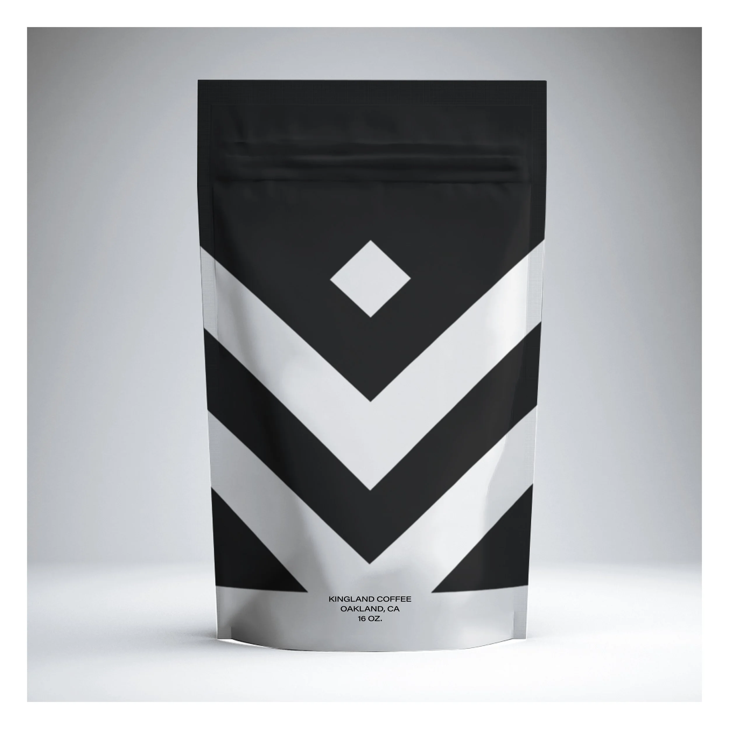 A black and white bag of Kingland Coffee, Oakland, CA, 16 oz, with a minimalist geometric design on the front.