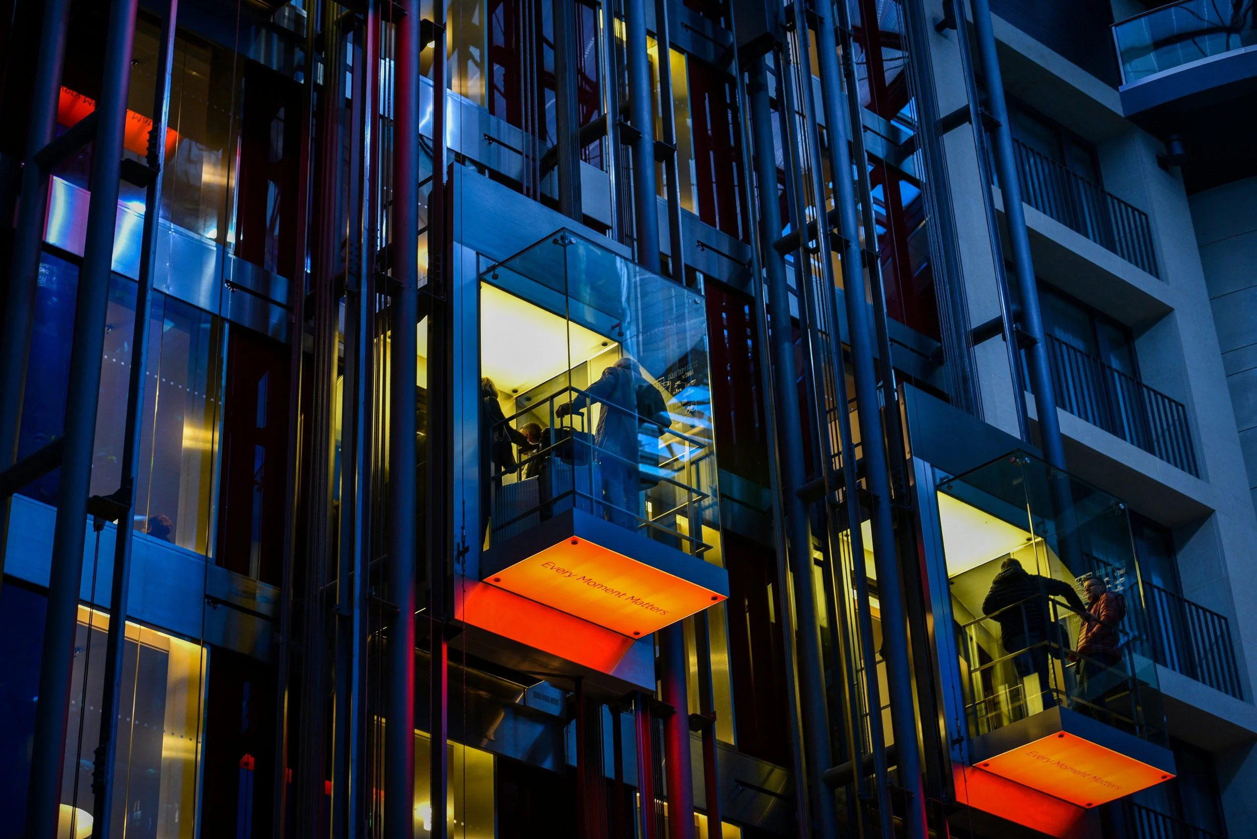 Modern urban building with elevator representing business development, regulatory navigation, and technology advocacy