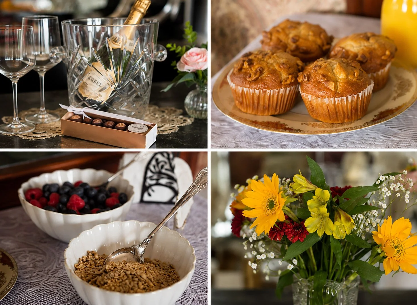 A breakfast or brunch table with glasses of wine, a champagne bucket, chocolates, muffins, bowls of berries and granola, and a vase of colorful flowers.