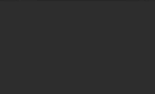 A blank dark gray or black background with no identifiable objects.