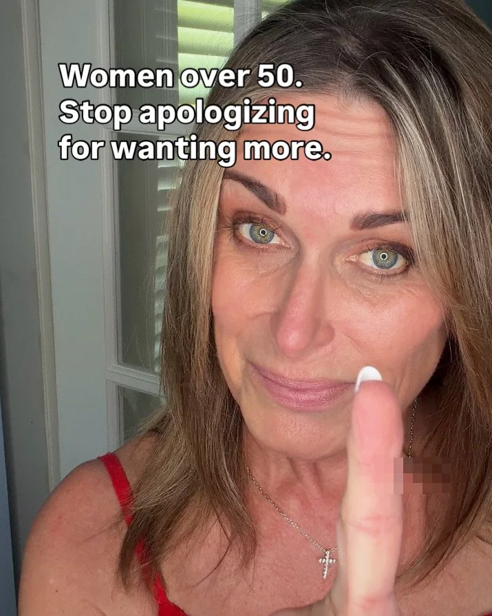 A woman over age 50 with blonde hair and green eyes giving a thumbs-up, wearing a red top, with text overlay that says 'Women over 50. Stop apologizing for wanting more.'