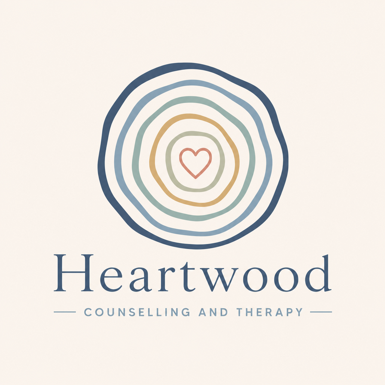 Logo for Heartwood Counseling and Therapy featuring a stylized tree cross-section with concentric rings and a small heart in the center. The text below reads 'Heartwood Counseling and Therapy.'