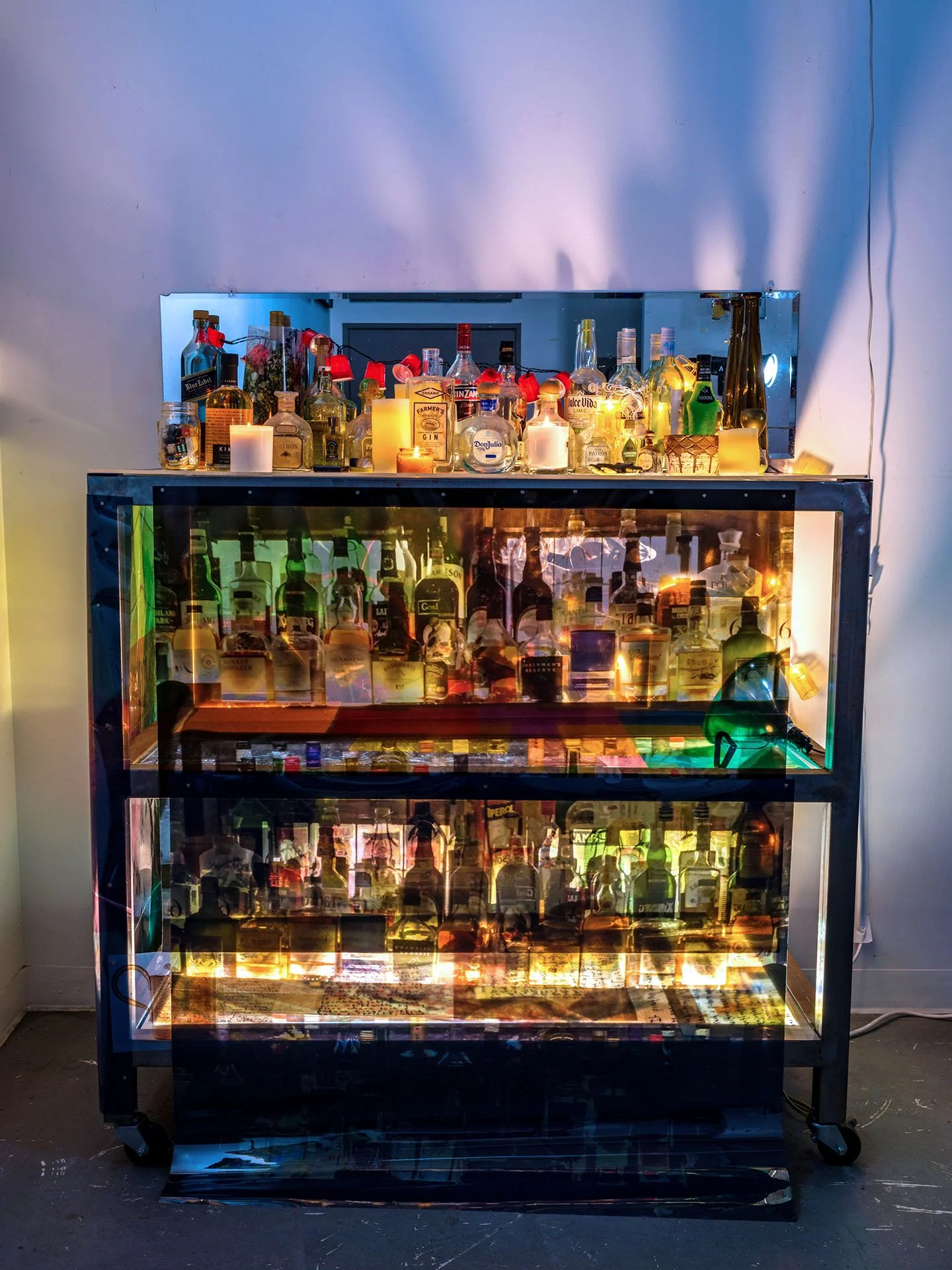 Detail of Bar, 2018, dimensions variable, photomontage on transparency, metal table, light box, mirrors, bottles
