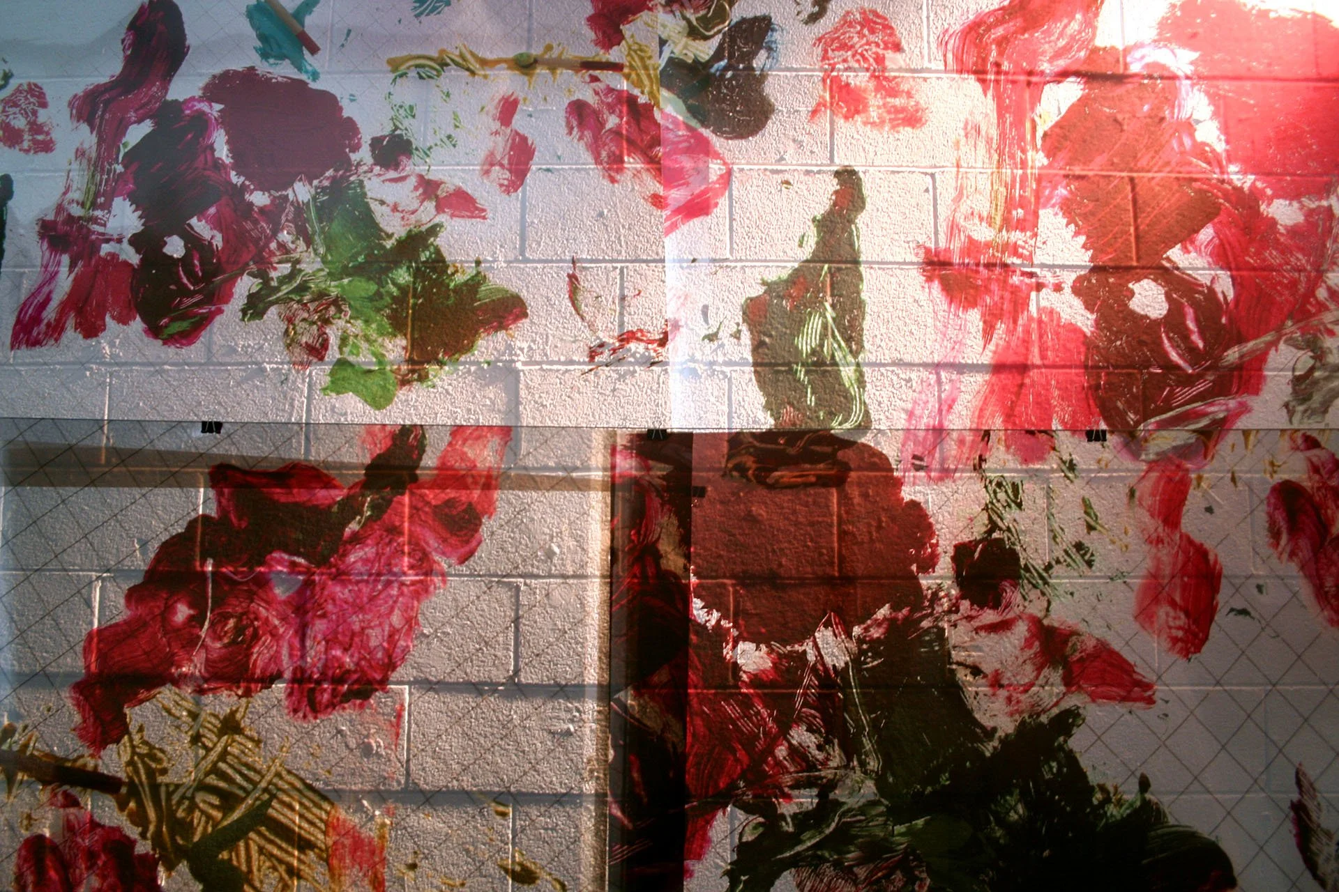 Studies for a Monument (detail), 2018. Oil and giclée on transparent film installed on cinderblock wall, dimensions variable
