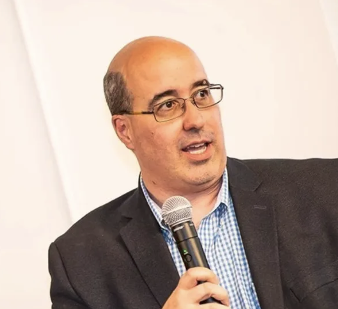 Richard Veltre, Jr. talks at a conference.