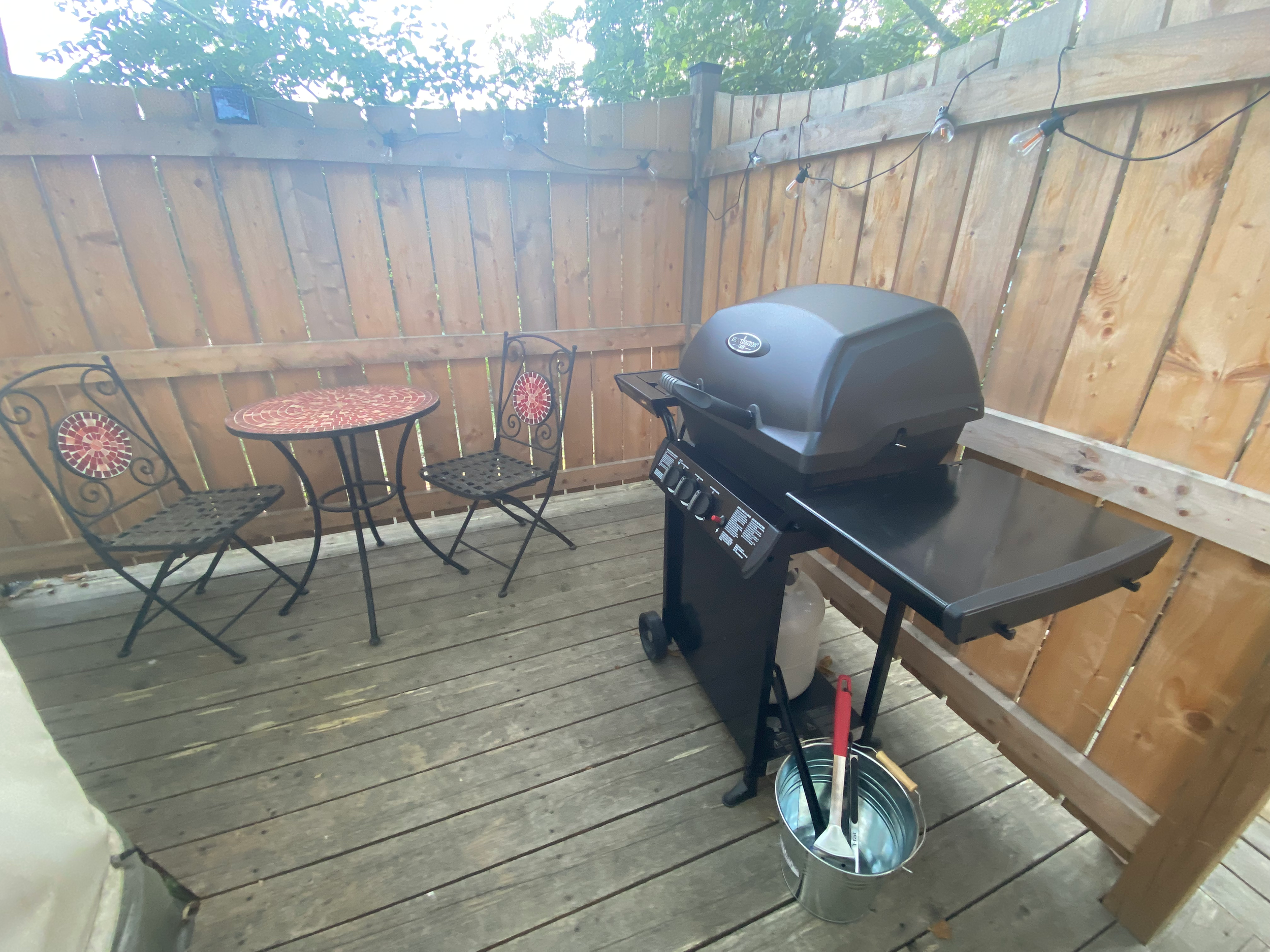 Private outdoor deck and BBQ area at glamping retreat