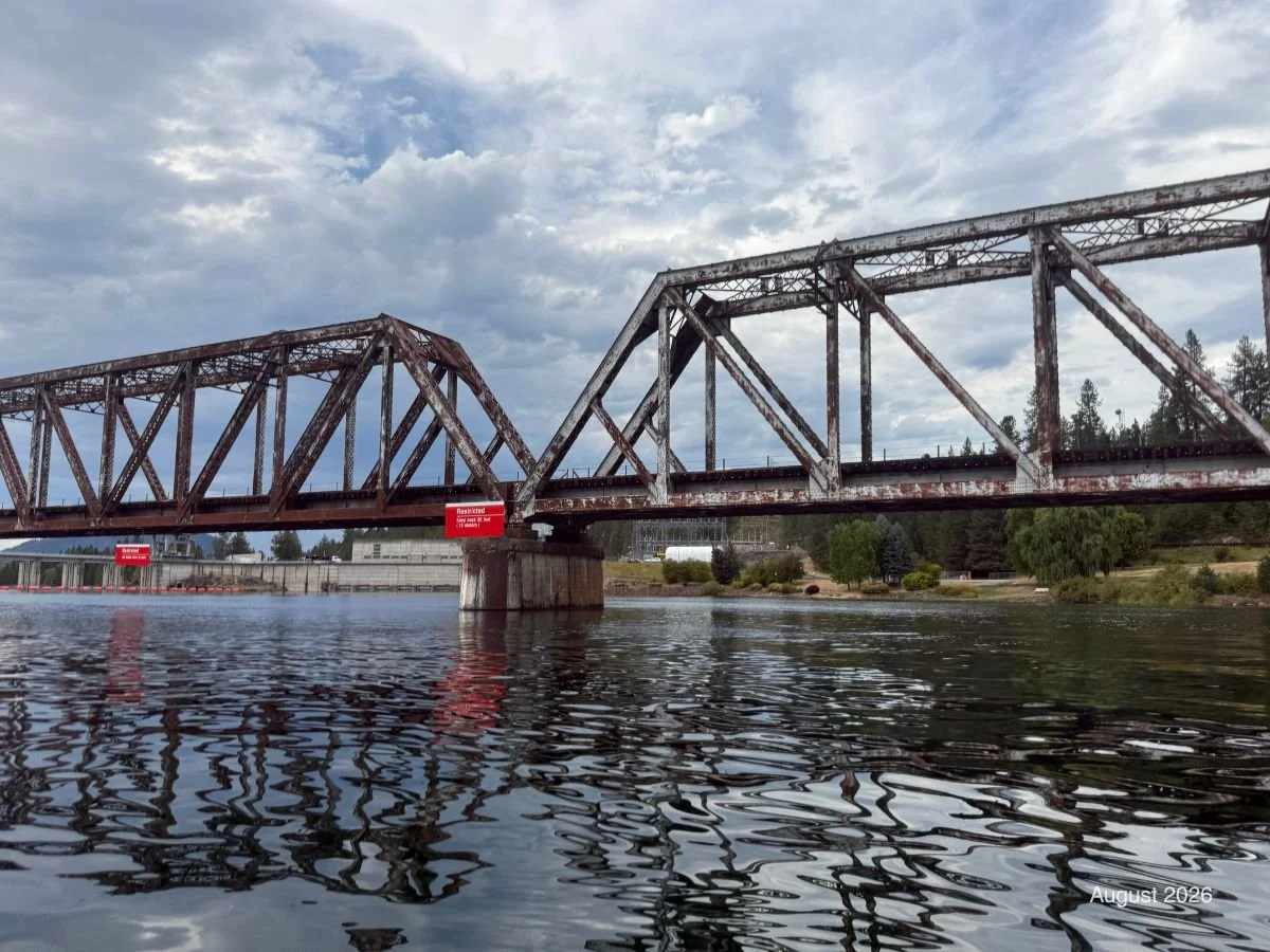 Railroad Bridge Near Albeni Dam: Railroad bridge spanning the Pend Oreille River near Albeni Dam. Restriction signs indicate that boaters cannot travel beyond the bridge.