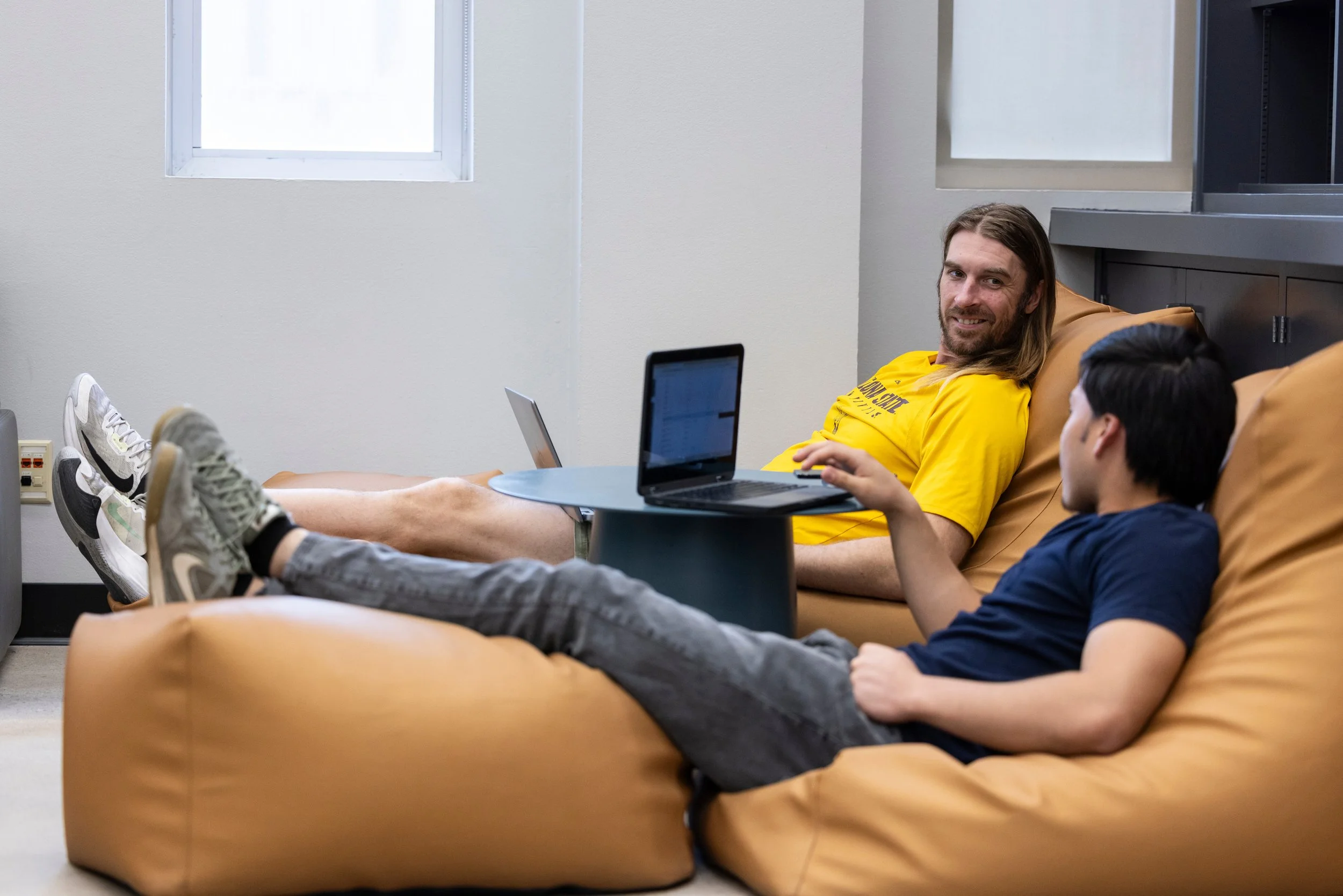 Guide checking in one-on-one with a student