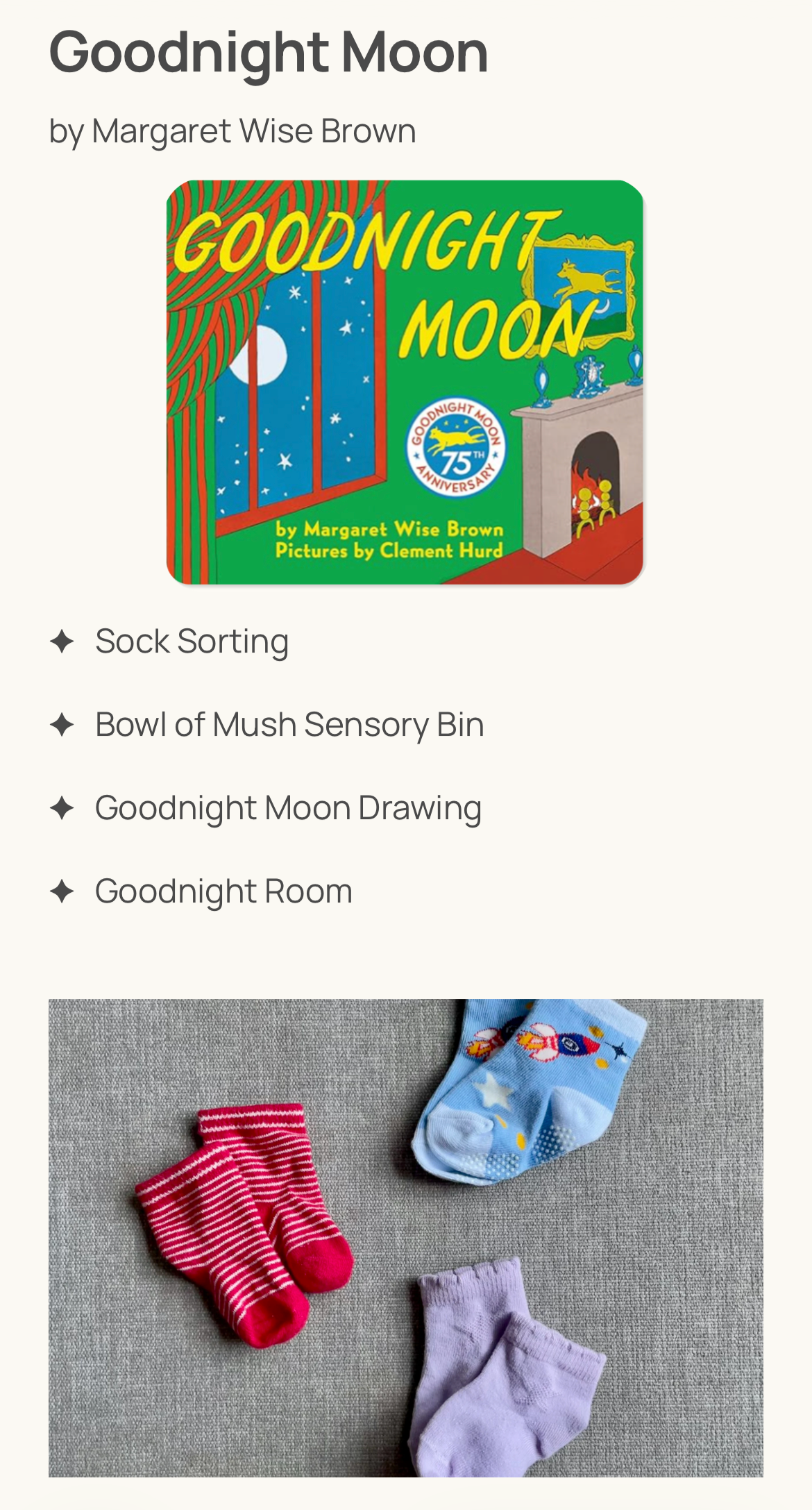 Four pairs of small socks in various colors and patterns, including red and white stripes, blue with space-themed designs, and plain lavender, arranged on a gray surface.