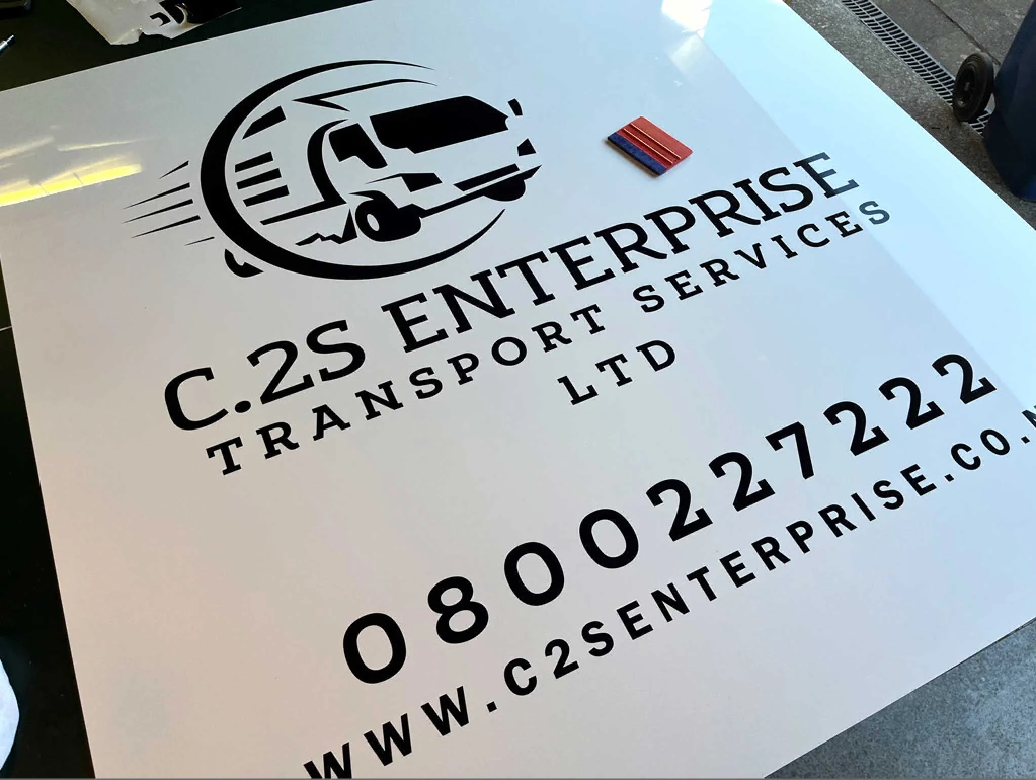 ACM sign board with C2S Enterprise logo using black Avery Vinyl