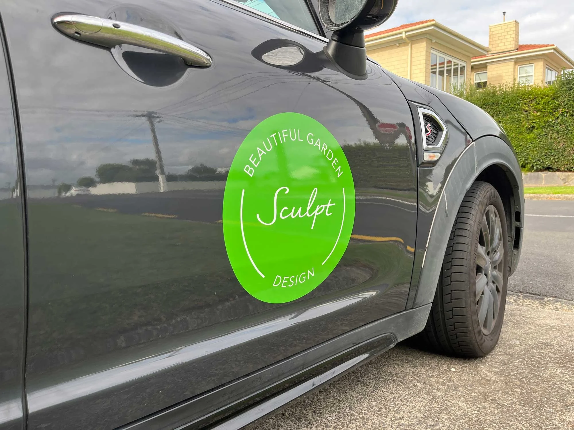 Green sculpt vinyl signage on vehicle door