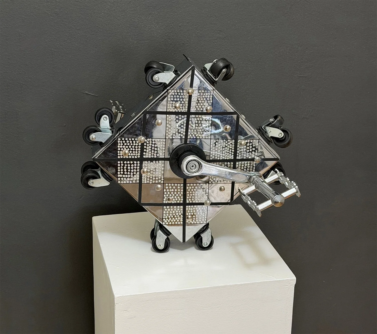 After Darwin, 2026, Chrome and rubber, 14”x14”x 2”