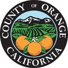 Seal of Orange County, California, featuring mountains, orange fruits, and green landscape