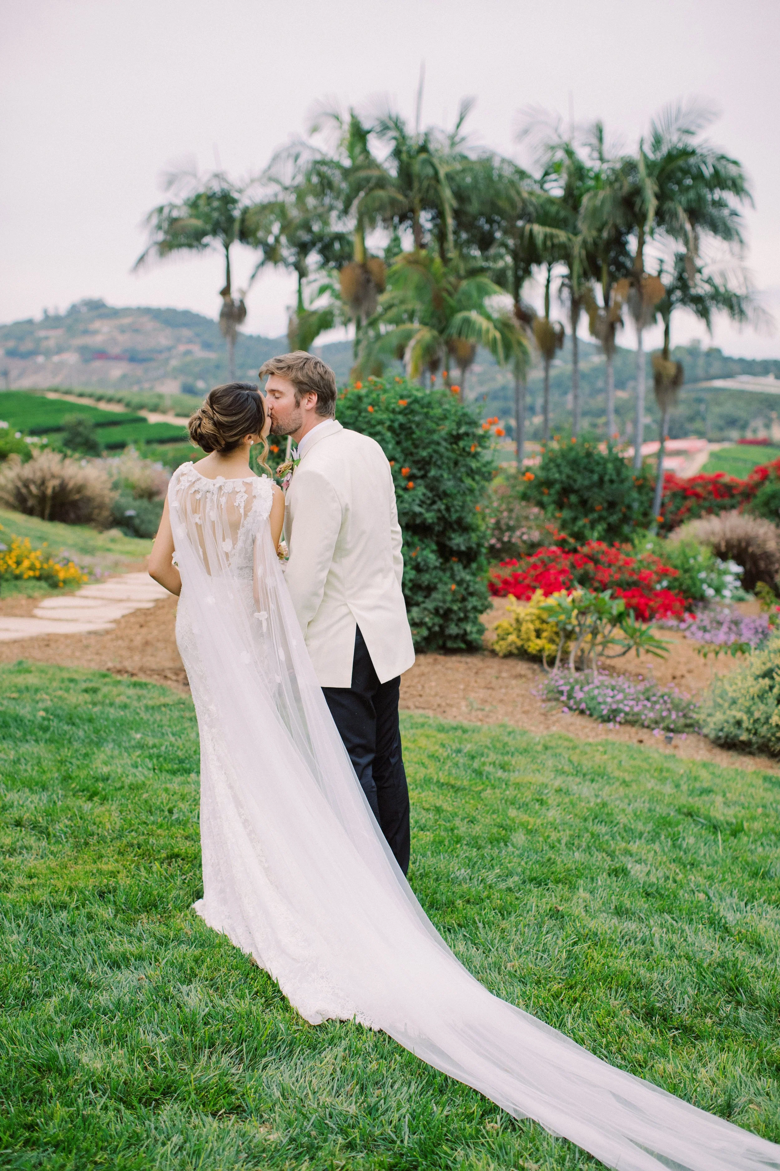 Newlywed couple sharing sunset moments at Rancho Vera Cruz in Oceanside CA