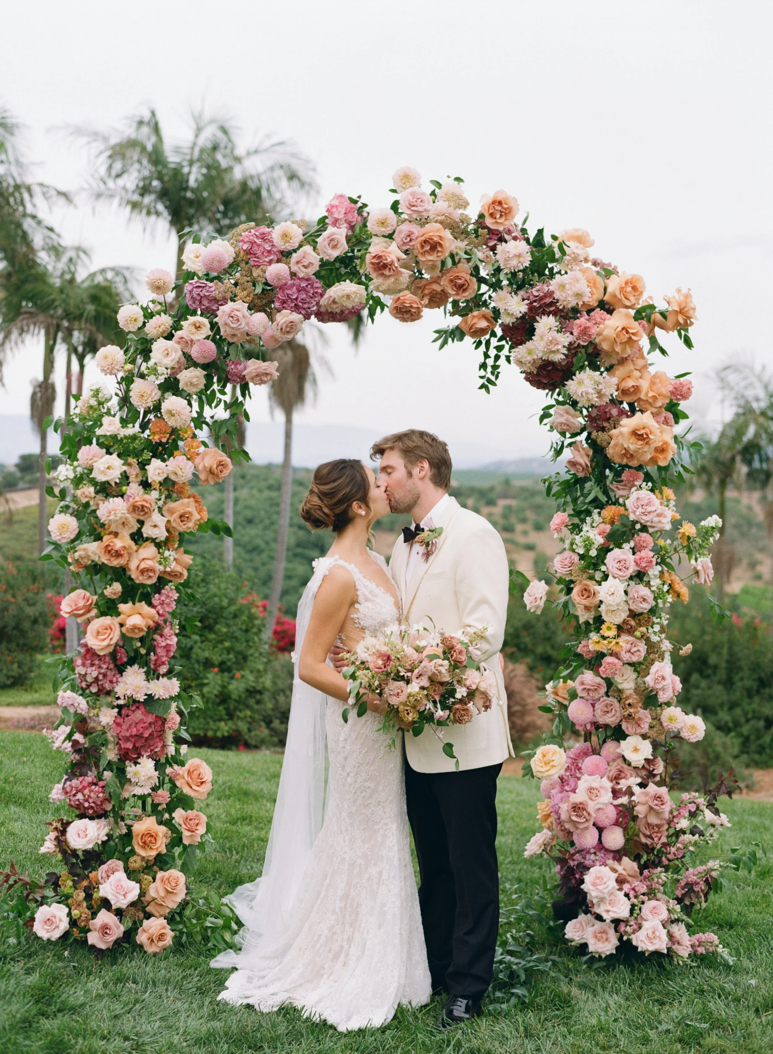 Romantic bride and groom floral portraits at Rancho Vera Cruz wedding venue in Oceanside California