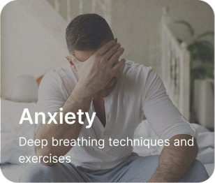 Man sitting on his copuch in a living room with his hand on his head feeling sad