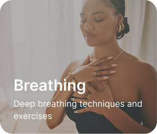 Woman sitting down with hands over chest taking in a deep breath