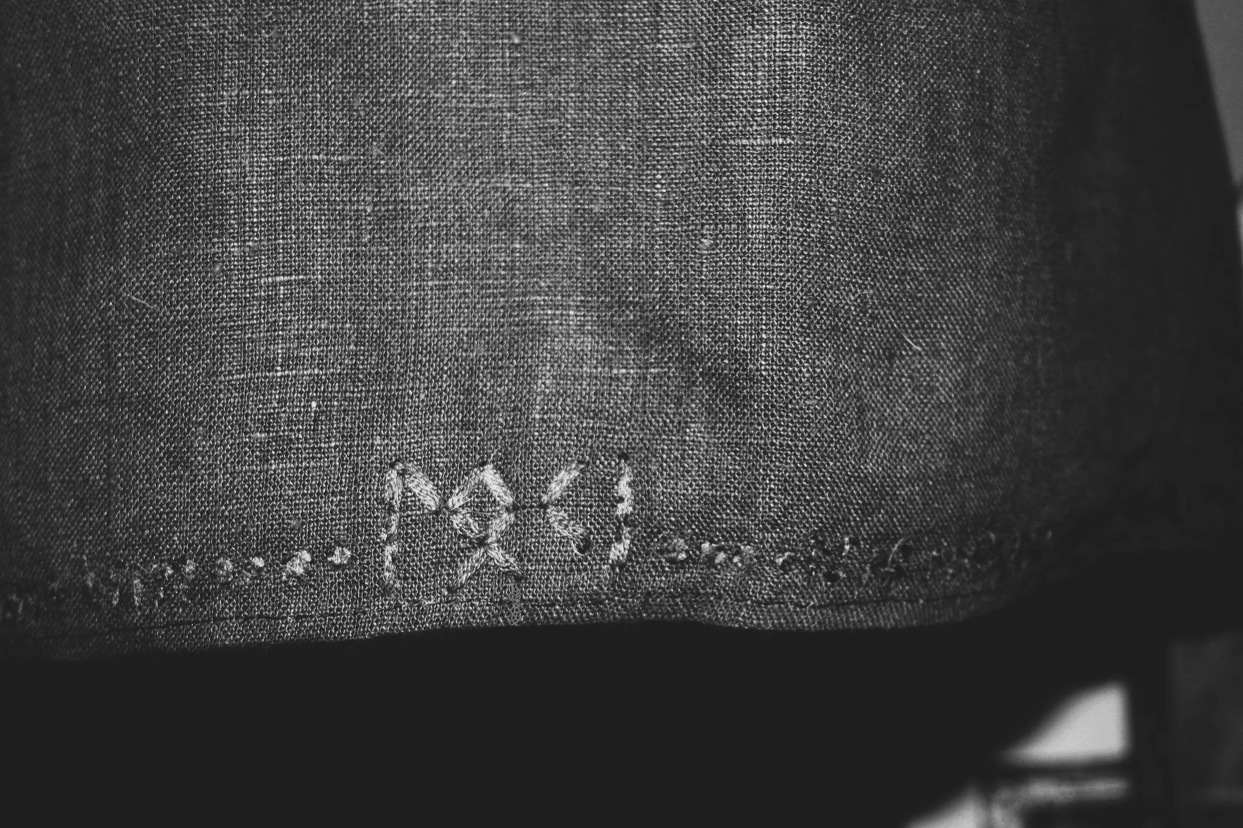 black and white zoomed in image of Loki alter cloth