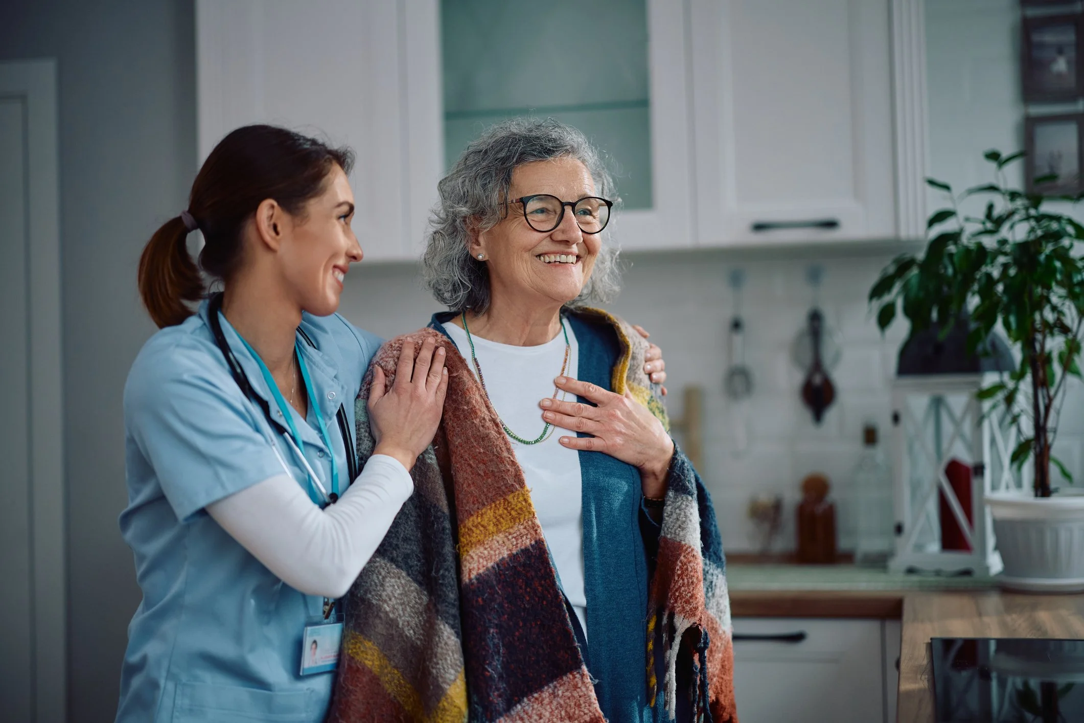 Provider guiding a patient in her home