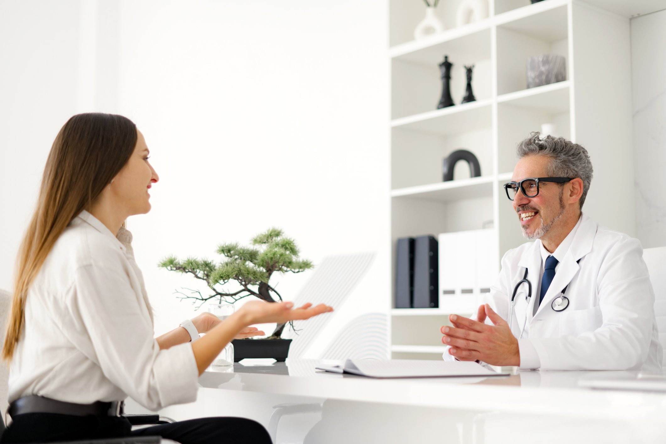 Patient talking to provider at a desk