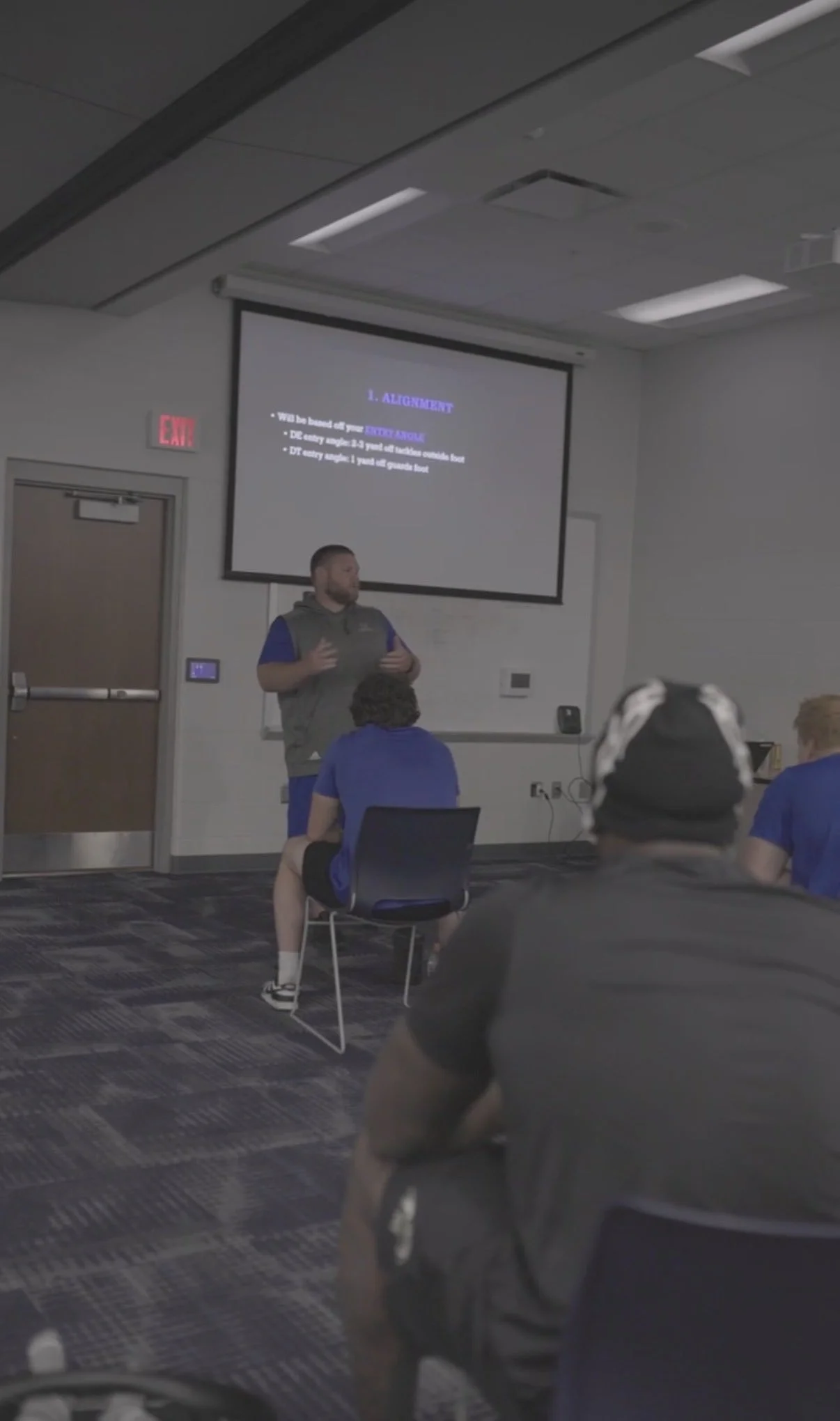 #DlineU Iowa Western Football Coach Aaron Terry coaching football fundamentals and details in meeting 