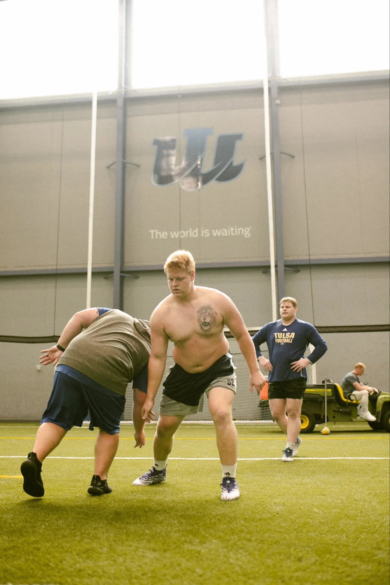 #DLINEU Iowa Western Football Coach Aaron Terry working football drills on an indoor field, with Jordan Van Den Berg and Joe Hjelle at Pass Rush Summit
