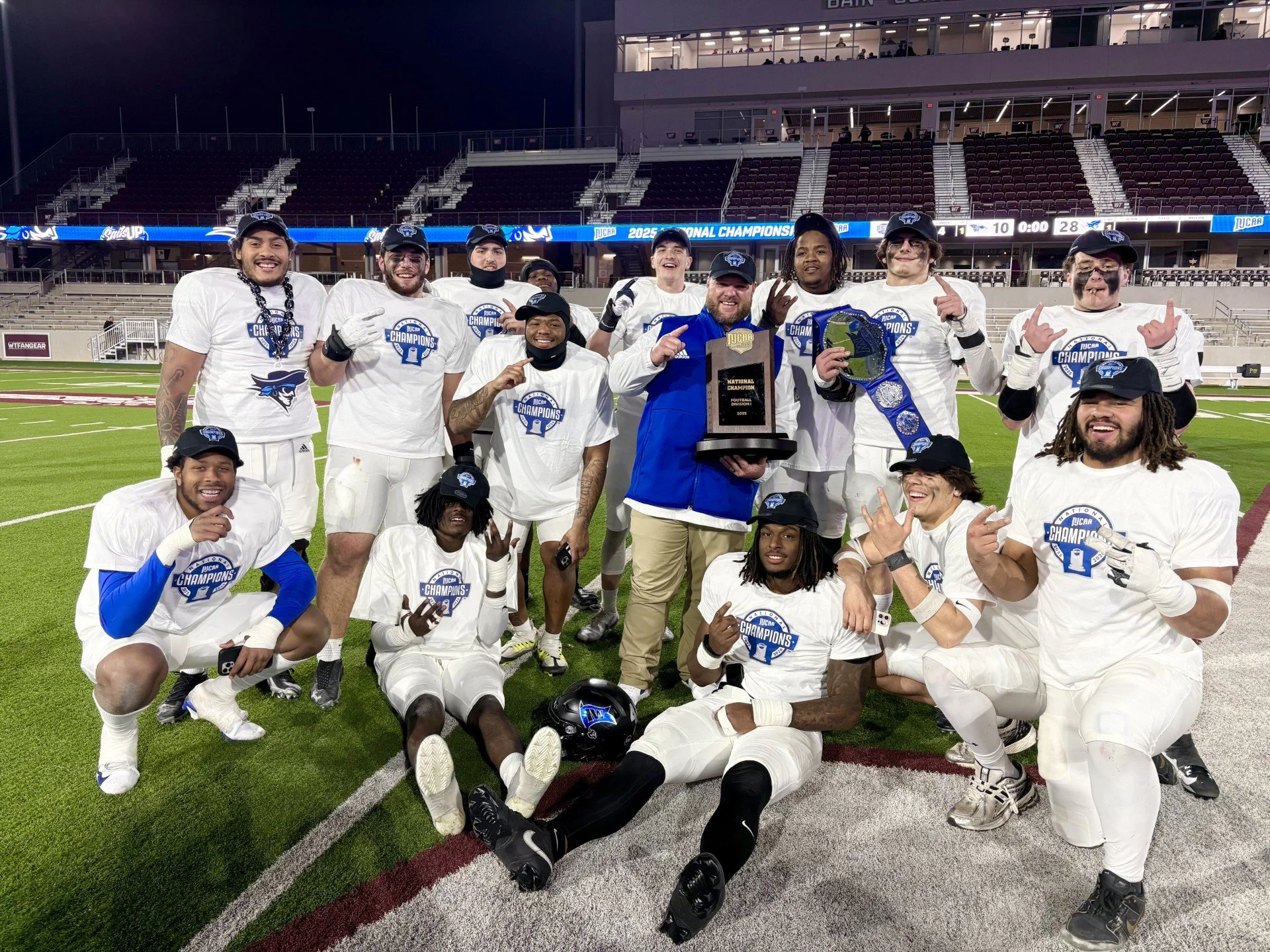 2025 Football National Champions Iowa Western, #DLineU Coach Aaron Terry, Andy Burburija, Jeremy Lewis, Blake Hawkins, Jaxon Cherry with National Championship Trophy