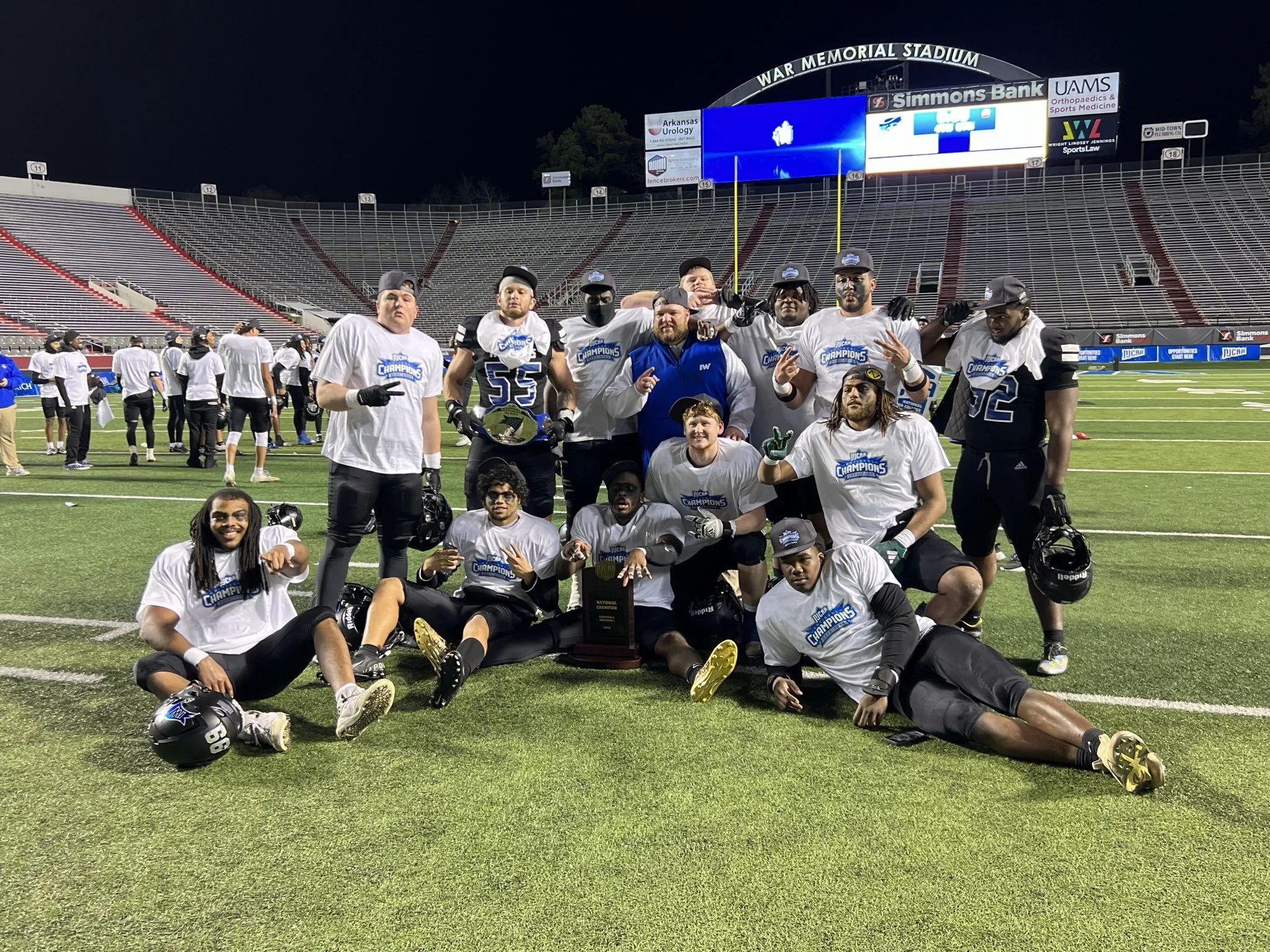 2023 Football National Champions Iowa Western, #DLineU Coach Aaron Terry, Clev Lubin, Kemari Kopeland, Joe Hjelle with National Championship Trophy