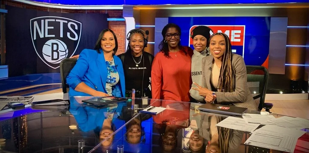 Five women sitting at a TV studio desk with Brooklyn Nets and ESPN logos in the background.