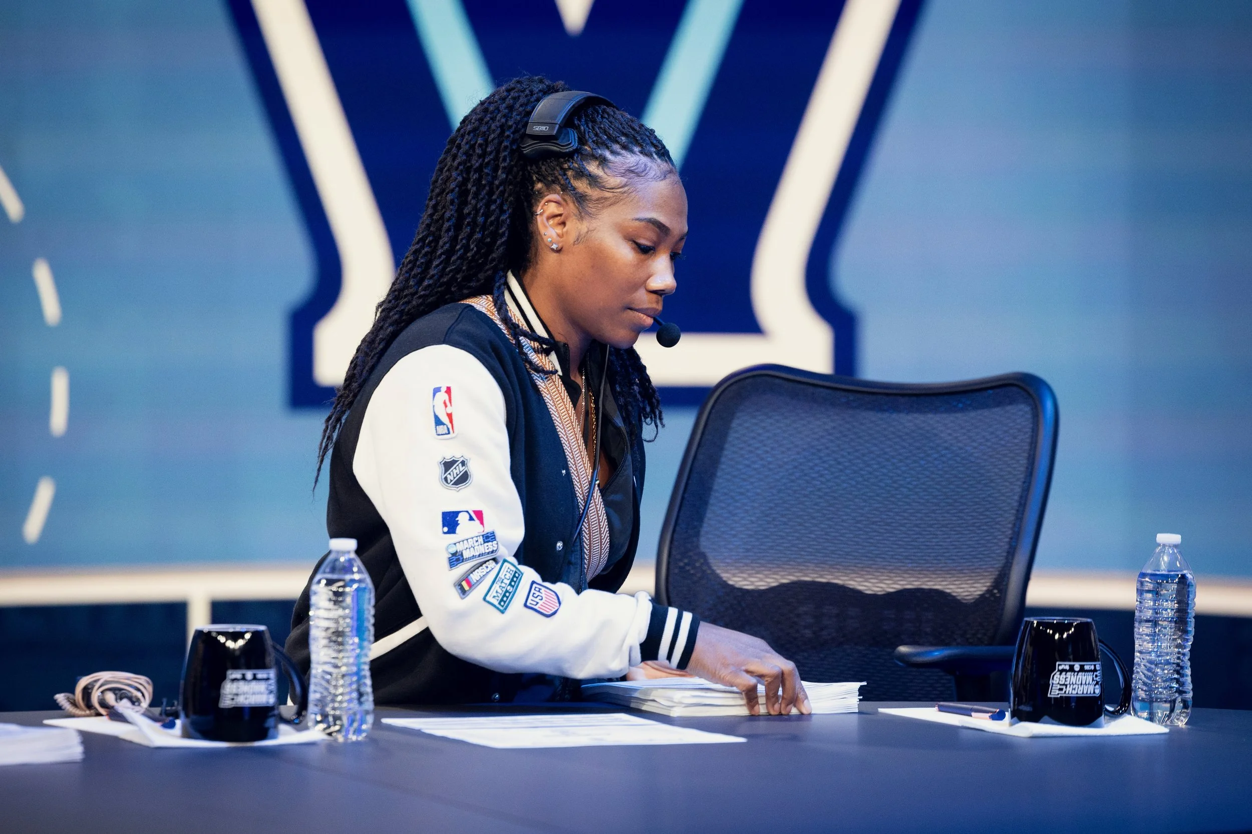 Nicole Monet sets up the desk for March Madness.